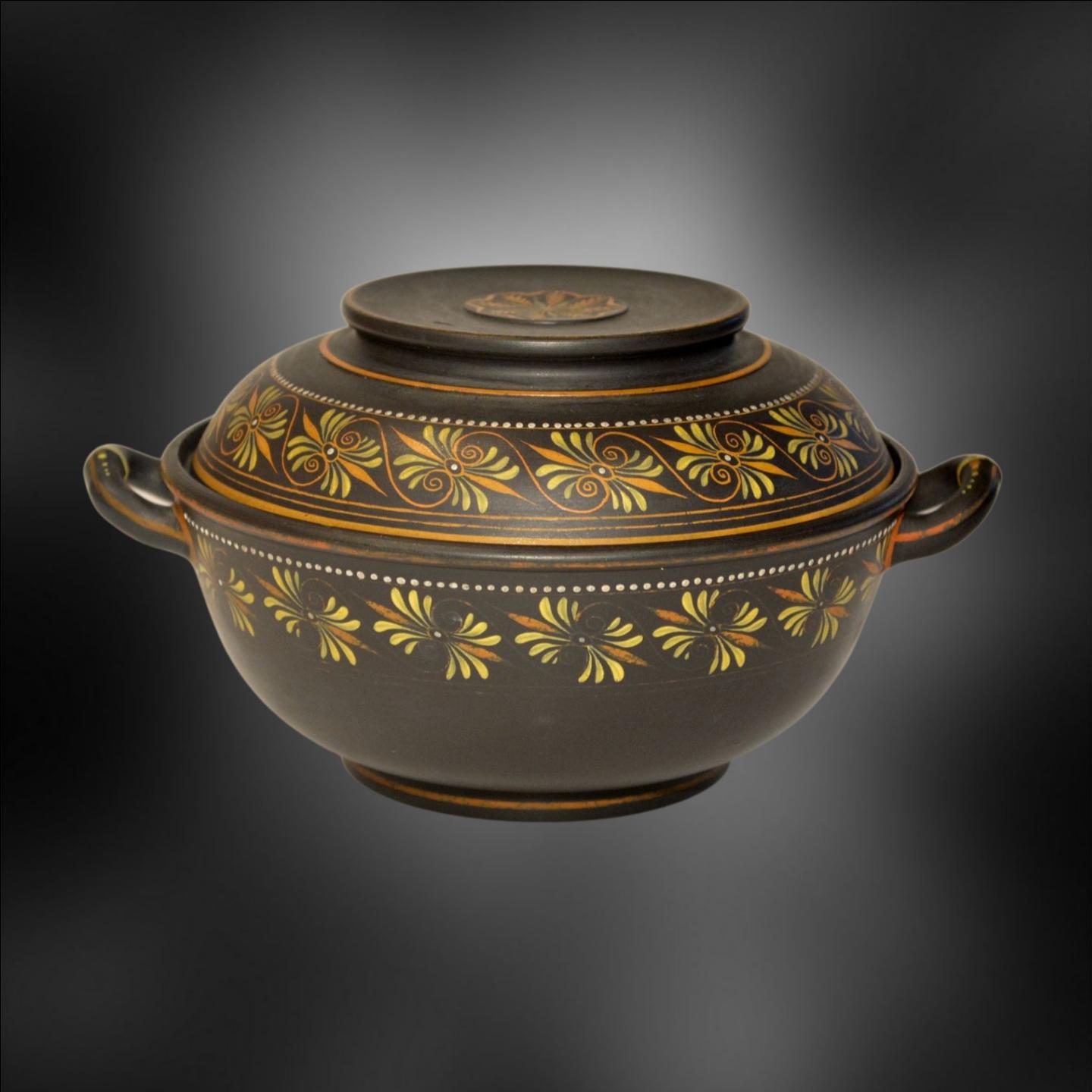 In black basalt, decorated with encaustic painting.

An écuelle is a French word that refers to a shallow dish or bowl, typically made of metal or ceramic, and used for serving food. Écuelle is also the French word for a small, shallow saucer used