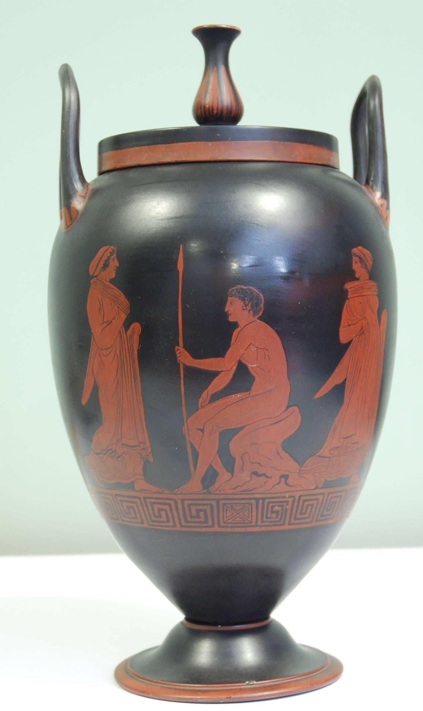 Encaustic painted basalt, after an early Greek vase, showing a woman approaching a naked youth, then looking back as she passes. 

To the reverse, a trainer and two youths with jumping weights.


 