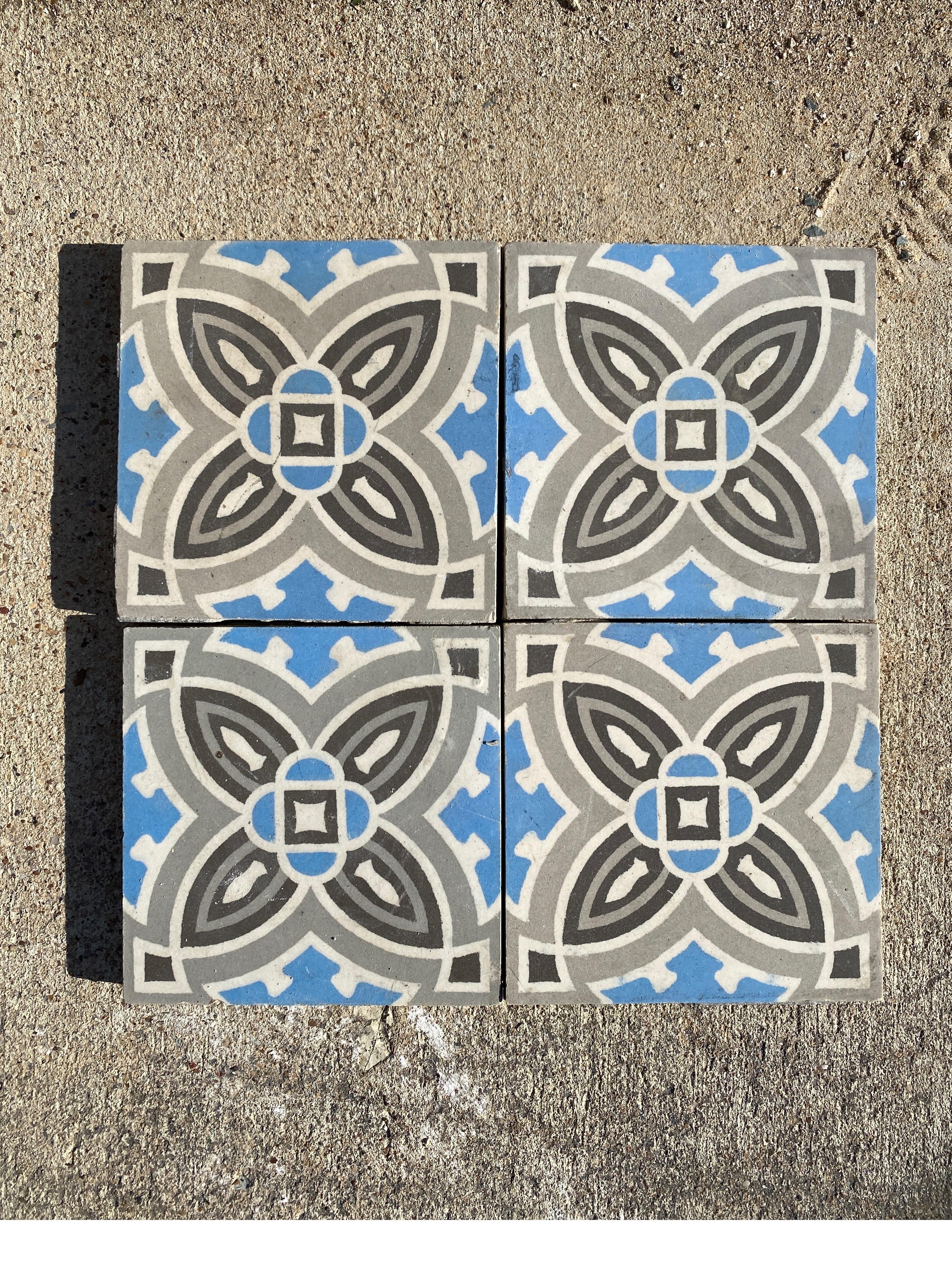Blue and grey encaustic tiles with beautiful floral borders.

Measures: Borders 2.75
