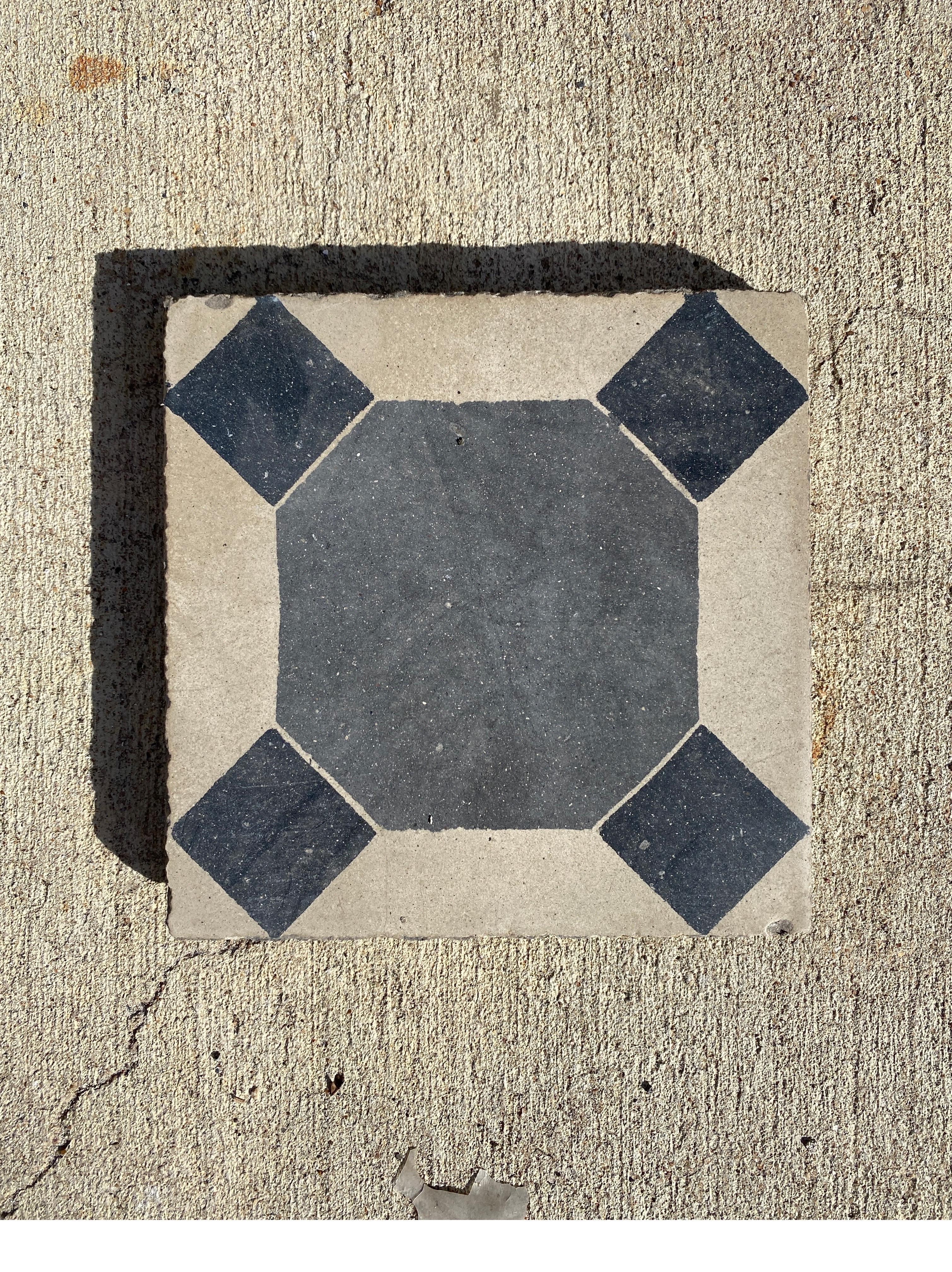 Beautiful black and tan encaustic tiles.

We have a lot of 190 square ft.