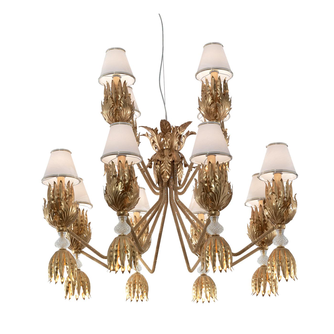 This striking chandelier reinterprets with a modern sensibility a Traditional Design and creates a unique lighting fixture that will enliven any decor. Its structure in hand forged iron with a gold finish comprises a central element from which four