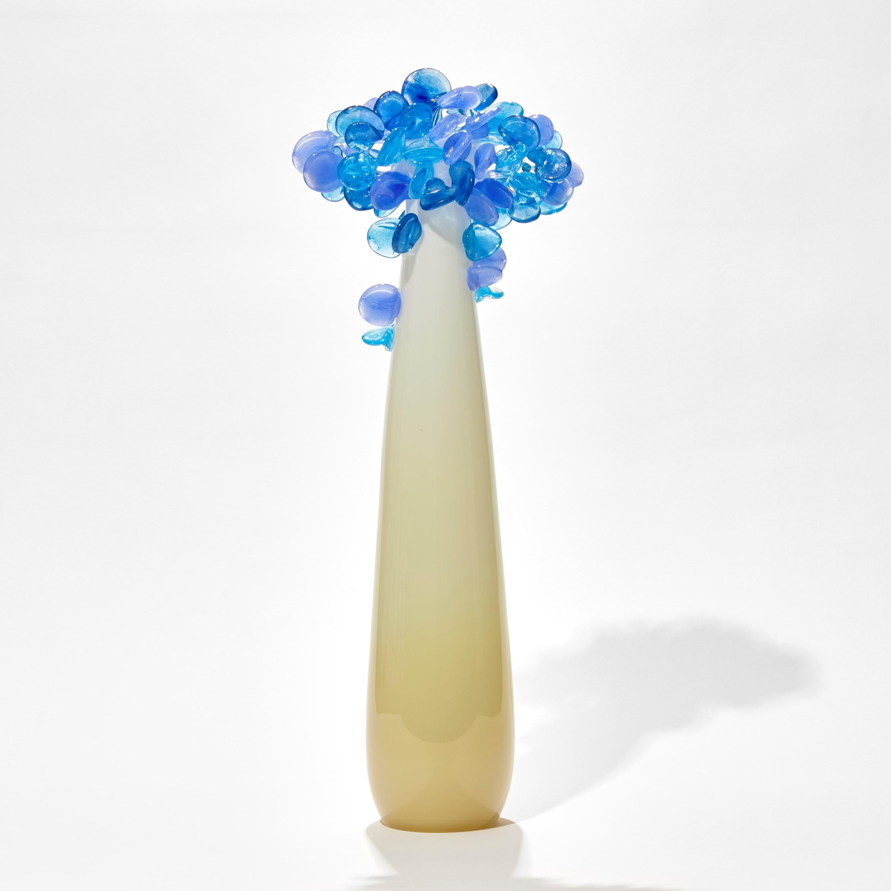 'Enchanted Dawn in Blues I' is a unique glass tree sculpture by the British artist, Louis Thompson.

With both his Enchanted Dawn and Dusk collections, Thompson brings a joyous and playful element to his glass. Gracious sweeping trunks are topped