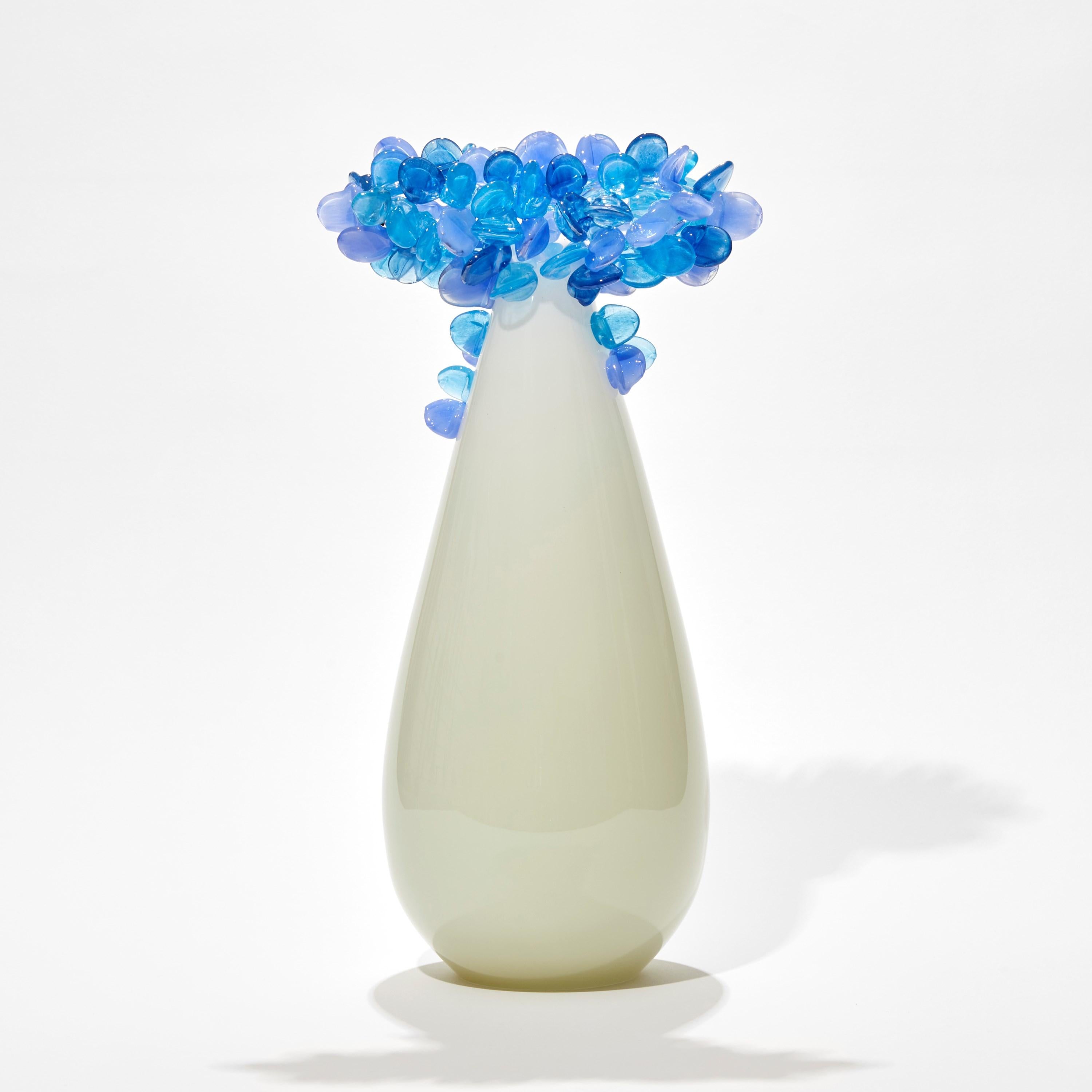 'Enchanted Dawn in Blues II' is a unique glass tree sculpture by the British artist, Louis Thompson.

With both his Enchanted Dawn and Dusk collections, Thompson brings a joyous and playful element to his glass. Gracious sweeping trunks are topped