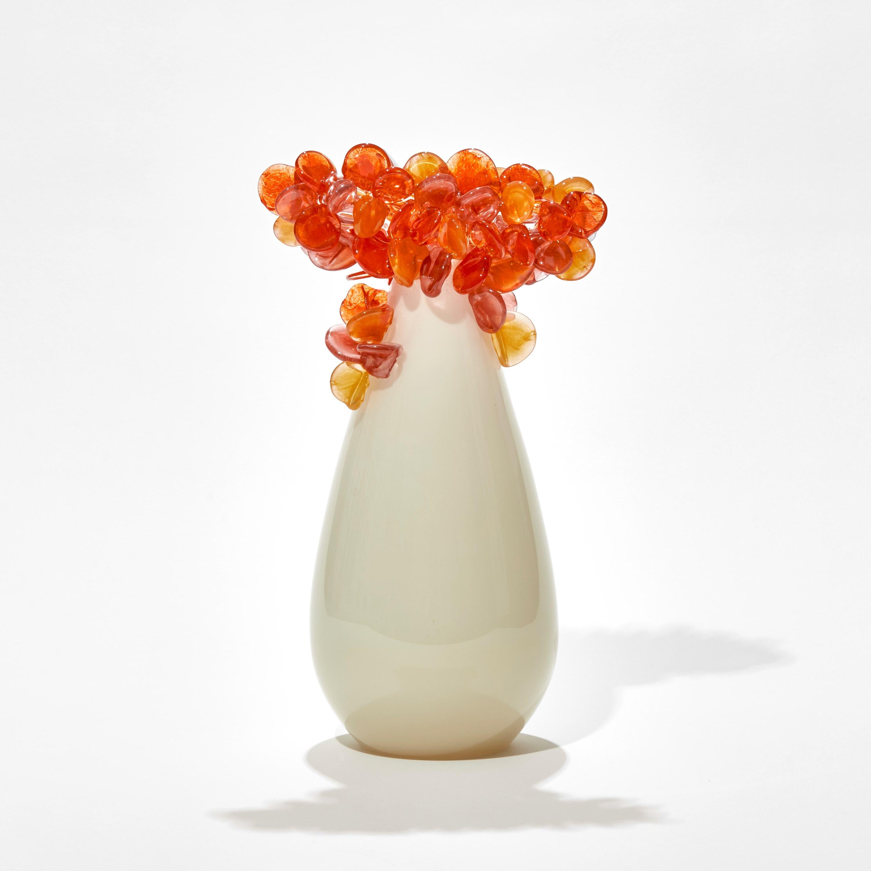 'Enchanted Dawn in Oranges II' is a unique glass tree sculpture by the British artist, Louis Thompson.

With both his Enchanted Dawn and Dusk collections, Thompson brings a joyous and playful element to his glass. Gracious sweeping trunks are