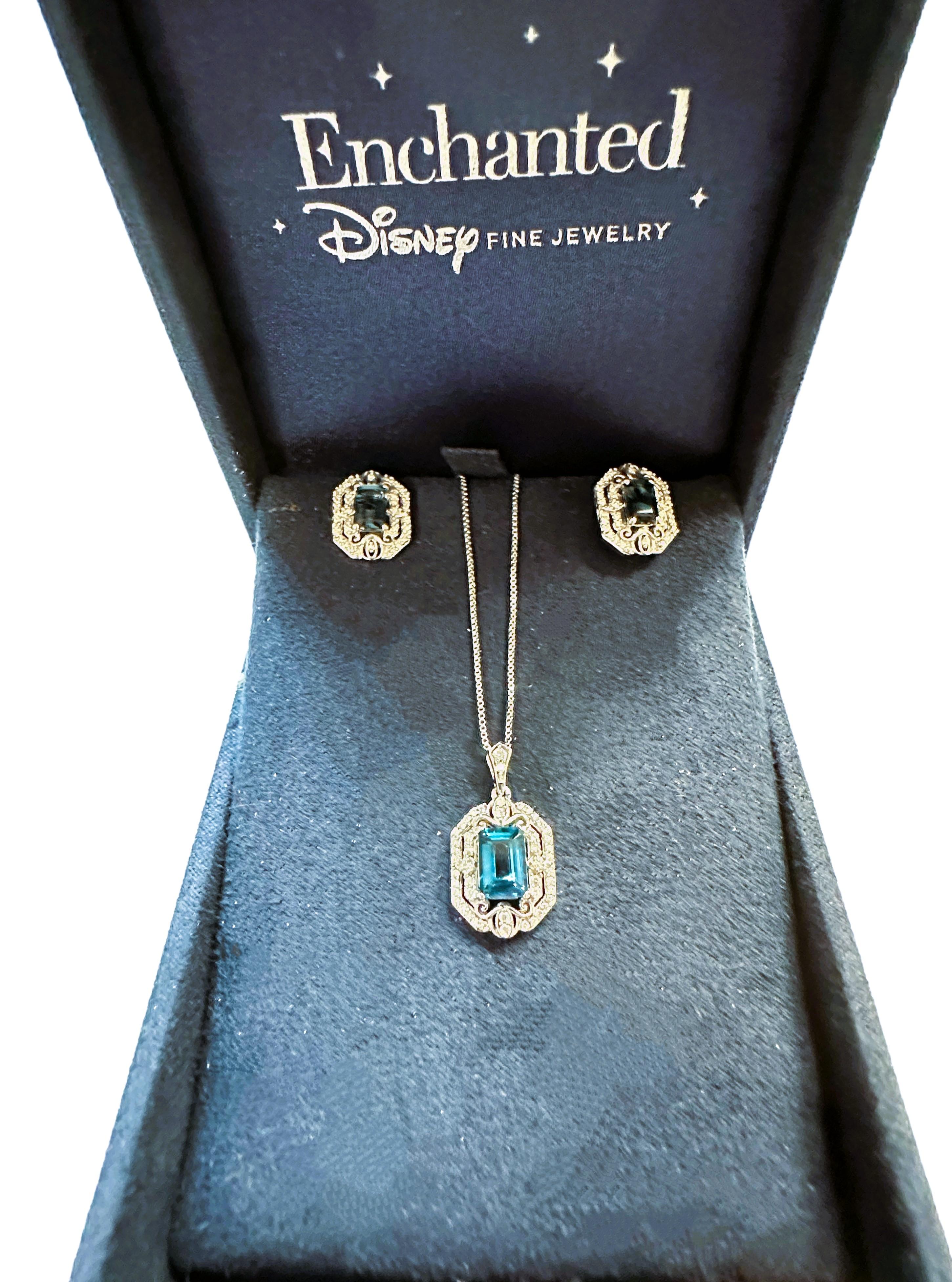 This is a beautiful Necklace and Earring set by Disney Enchanted.  It comes in the original box.  The chain is 18 inches long and the pendant plus bail is .88 inches long and .50 inches wide.  It's just a beautiful design. It has a beautiful Emerald