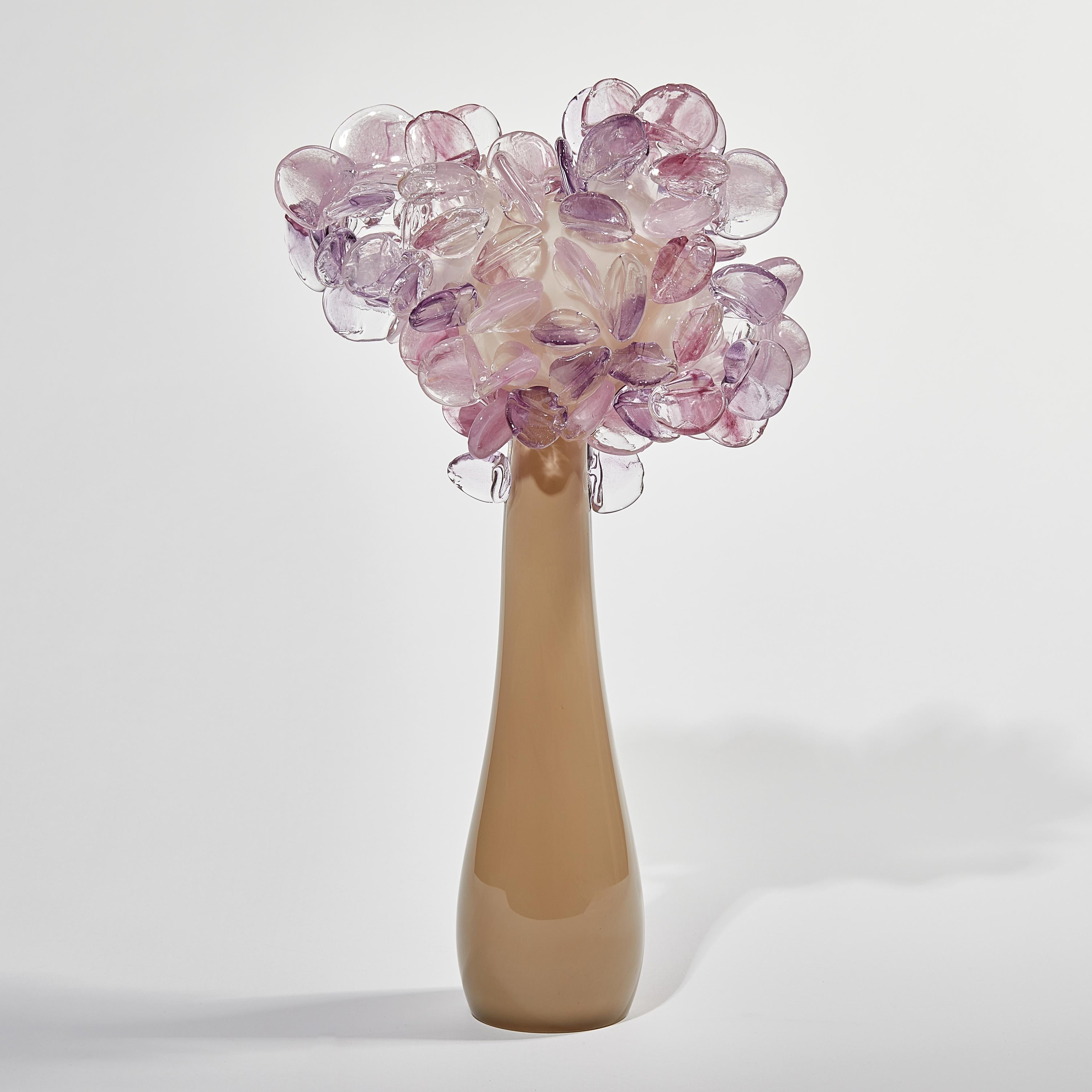 Enchanted dusk in pink & bronze is a unique glass tree sculpture by the British artist Louis Thompson. With both his Enchanted Dawn and Dusk collections, Thompson brings a joyous and playful element to his glass. Gracious sweeping trunks are topped