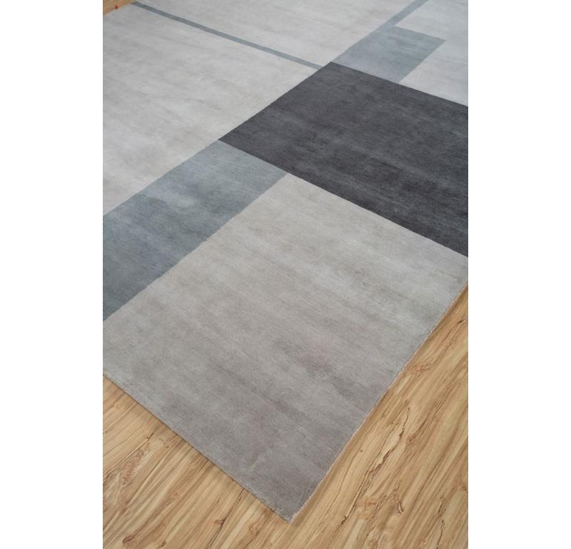 What if a rug could capture the essence of duality, blending complexity with simplicity seamlessly? presents a masterpiece of modern craftsmanship from rural India. Hand-knotted with meticulous care, each piece embodies a delicate balance between