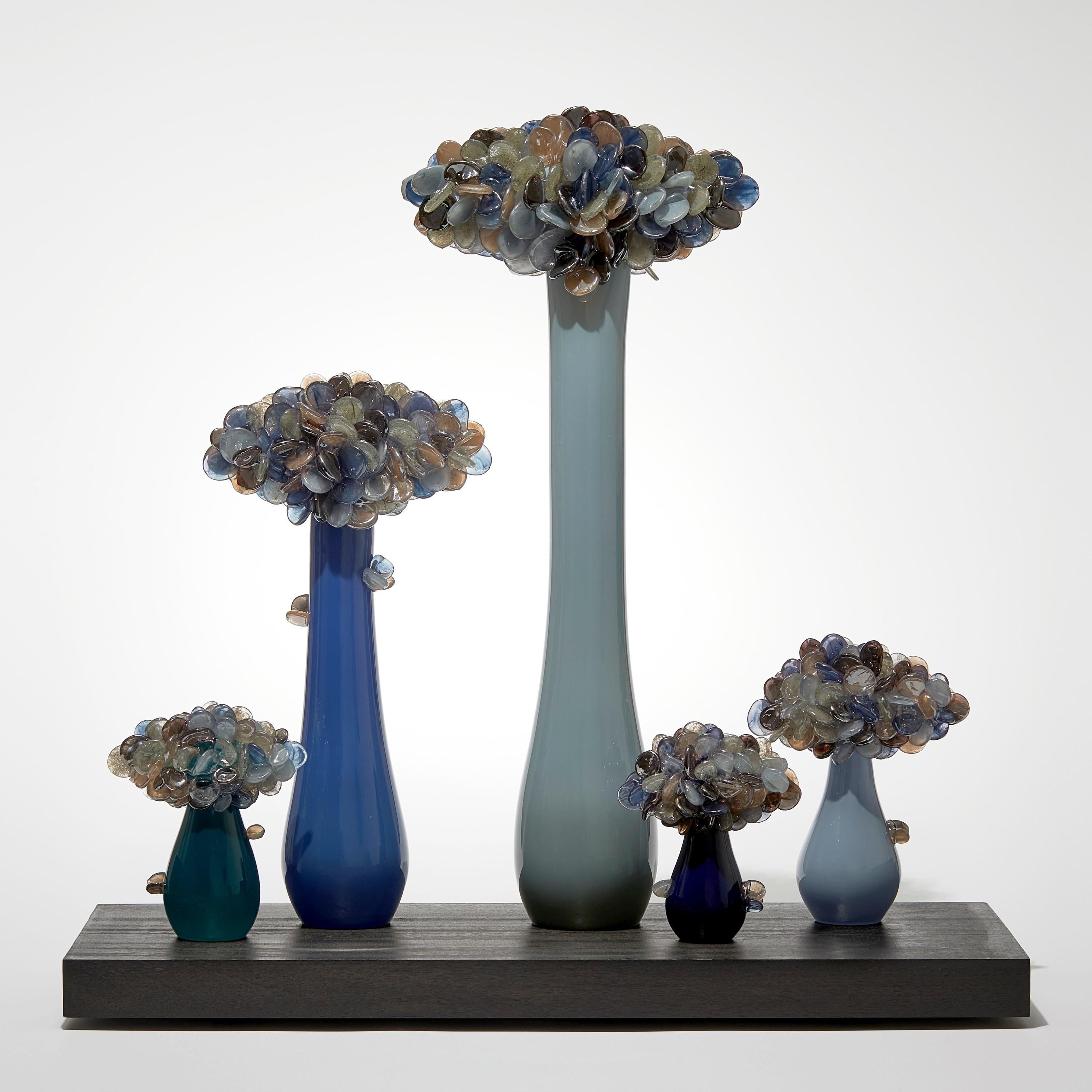 'Enchanted Mori Dusk' is a unique sculpted glass installation by the British artist, Louis Thompson.

Thompson's Enchanted Mori are inspired by the practice of bonsai, echoing its artistic intention to create a higher level of aesthetic refinement.