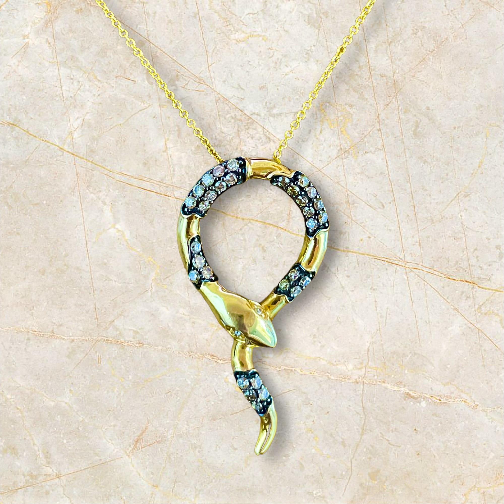 Embrace mystical elegance with this stunning 14K yellow gold snake necklace, embellished with shimmering diamonds. The serpent motif, representing wisdom and eternity, is beautifully crafted to create a striking and sophisticated accessory. Ideal