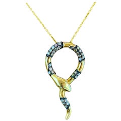 Serpente incantato: Collana con serpente di diamanti in oro giallo 14K