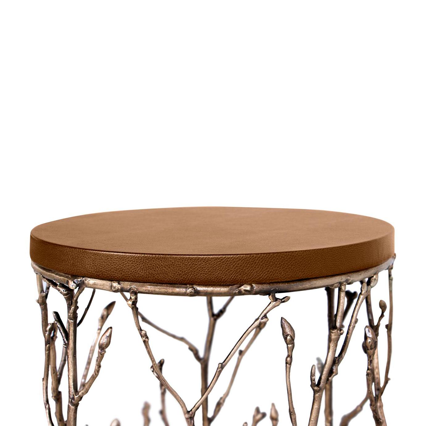 Our artisans have masterfully captured the alluring essence of an enchanted forest with this side table. The antique gilded branch like structure can't help but mesmerize the beholder.
