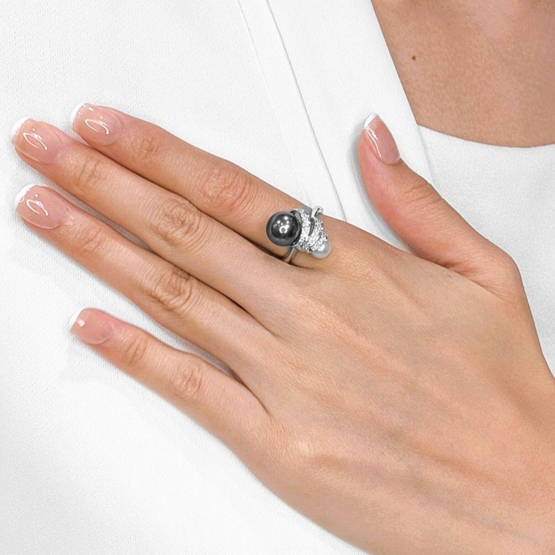 Discover unparalleled elegance with this new, exquisite ring, meticulously crafted in radiant 18K white gold. This unique piece showcases a captivating duo of pearls: a magnificent 9.9MM round South Sea pearl, renowned for its rare and mesmerizing