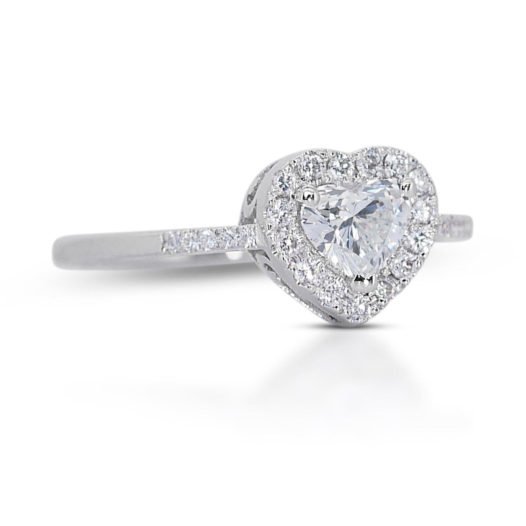 Enchanting 0.85ct Diamonds Halo Ring in 18k White Gold - GIA Certified

Celebrate elegance and romance with this stunning diamond halo ring crafted in luxurious 18k white gold. The centerpiece of this enchanting ring is a dazzling heart-shaped