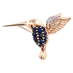 Enchanting 14k Yellow Gold Bird Brooch with Sapphire and Diamond