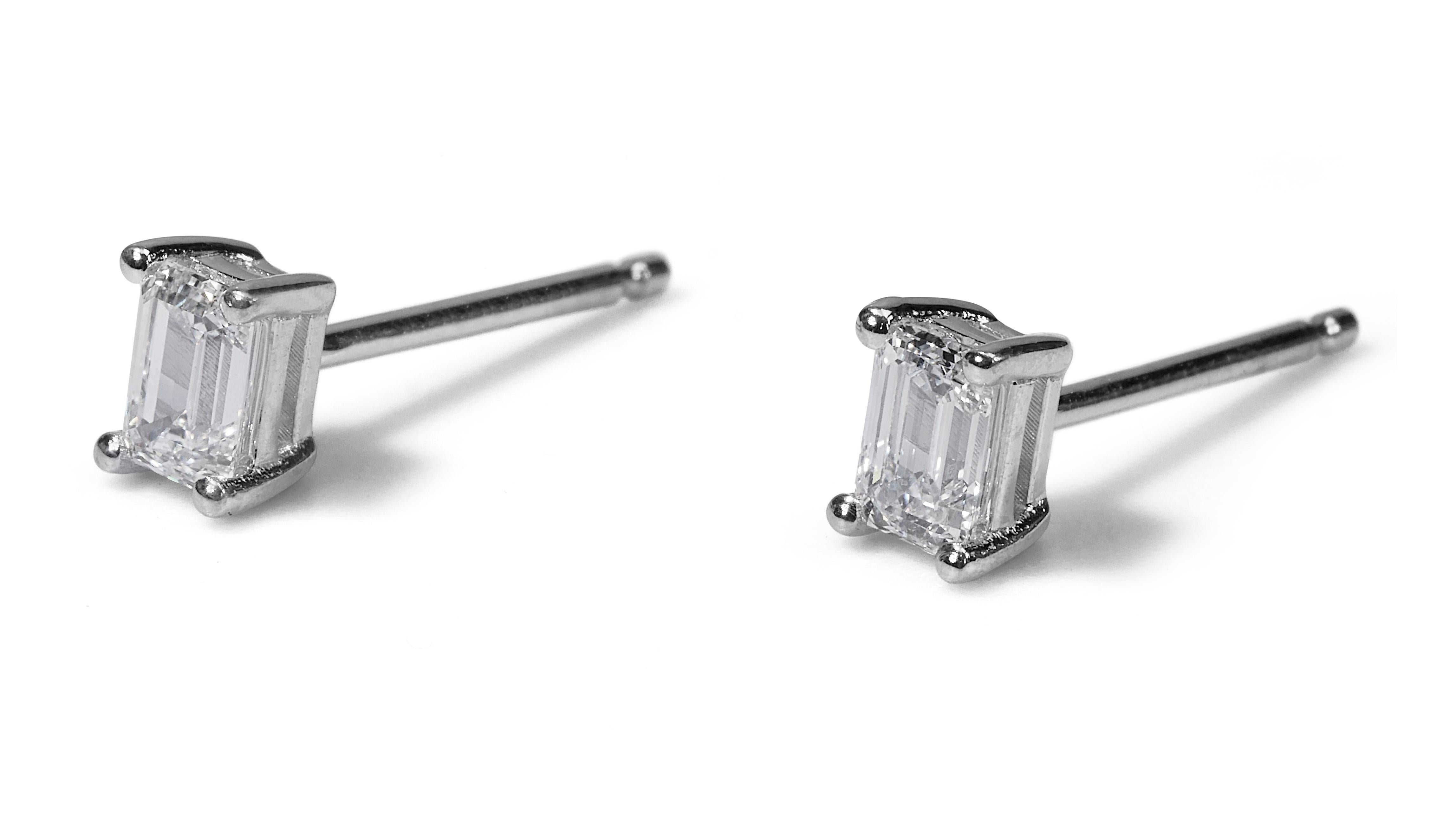 
Enchanting 18K White Gold Natural Diamonds Stud Earrings w/1.41 Carat - GIA Certified

These captivating 18K white gold stud earrings feature a total of 1.41 carats of dazzling emerald cut diamonds. The emerald cut creates a unique and elegant