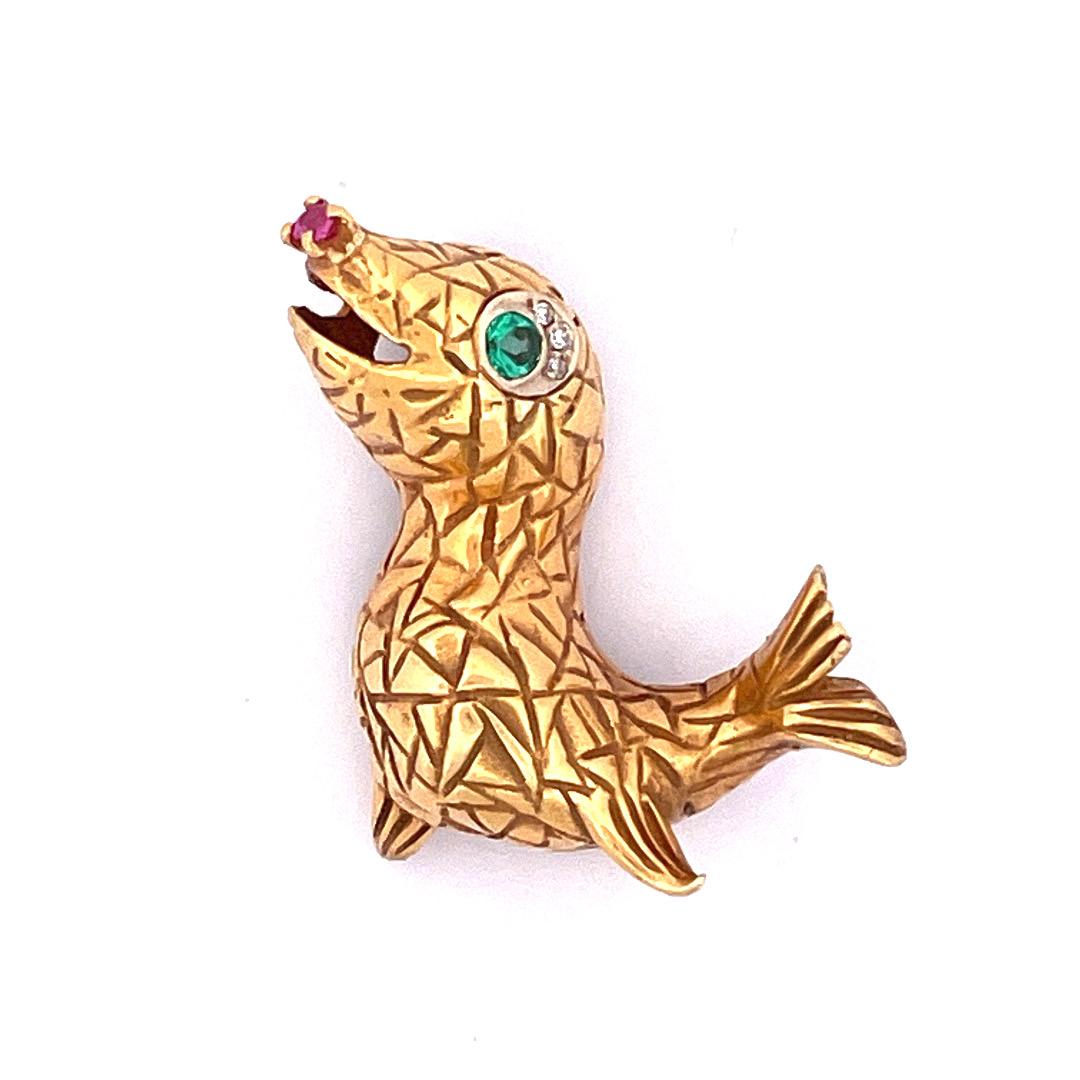 Enchanting 18k Yellow Gold Seal Brooch with Emerald Eyes and Ruby Nose

Embrace the enchantment of our Enchanting Seal Brooch, expertly crafted in 18k yellow gold. This captivating brooch features a lovable seal design. The seal's eyes are adorned