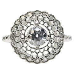 Enchanteresse bague de fiançailles Art déco filigrane en platine avec diamants