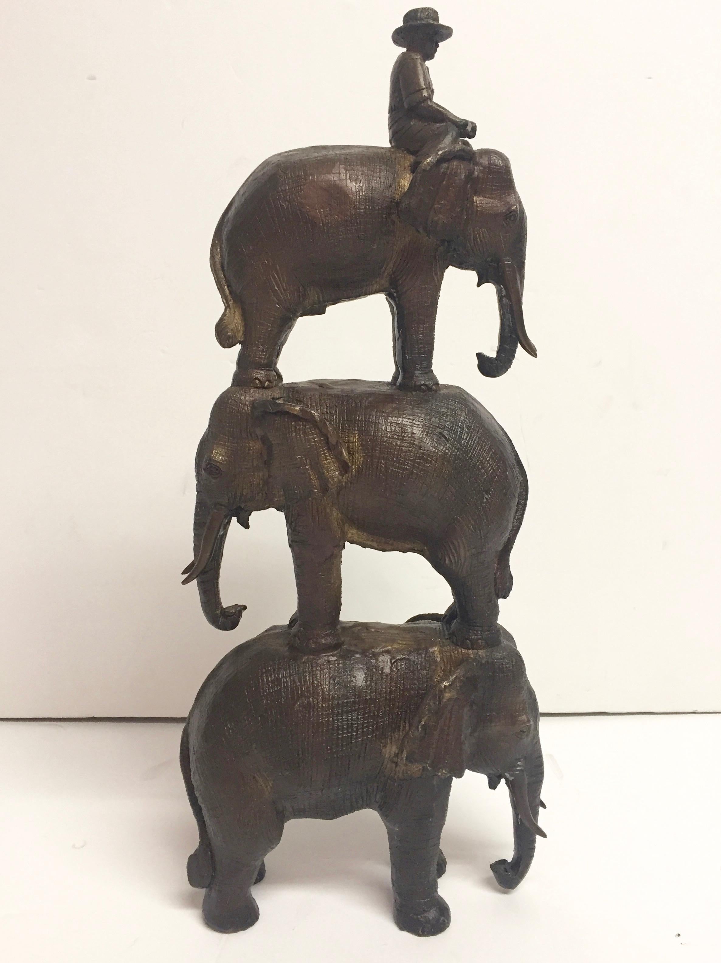 Enchanting Bronze Sculpture of a Man Riding Three Elephants For Sale 3