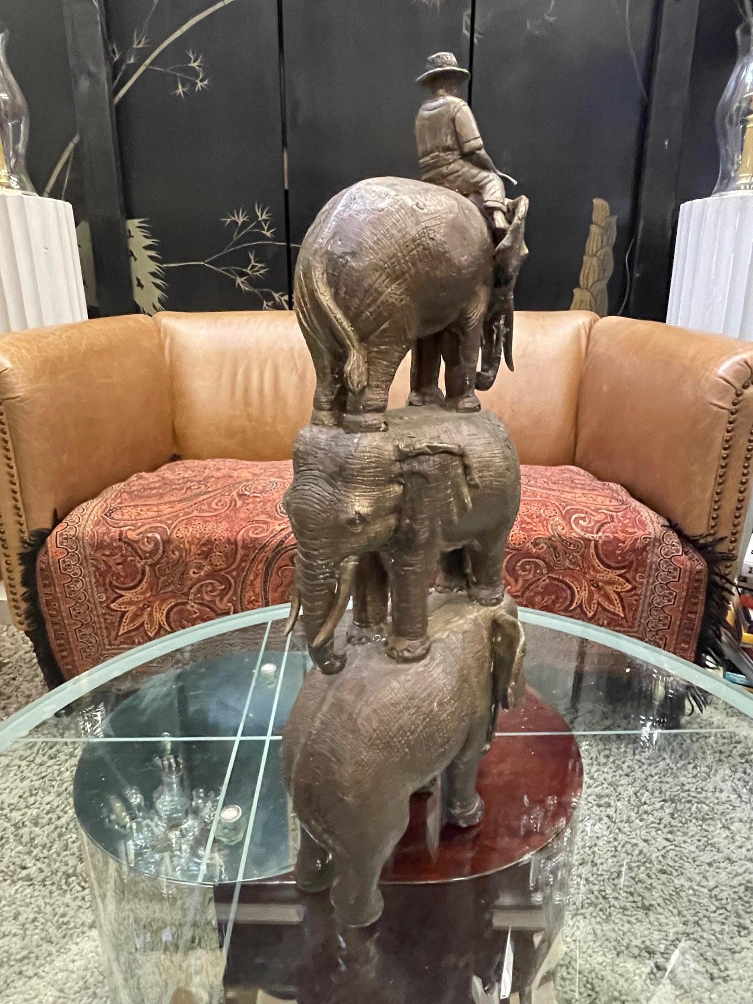 Enchanting Bronze Sculpture of a Man Riding Three Elephants In Excellent Condition For Sale In Hopewell, NJ