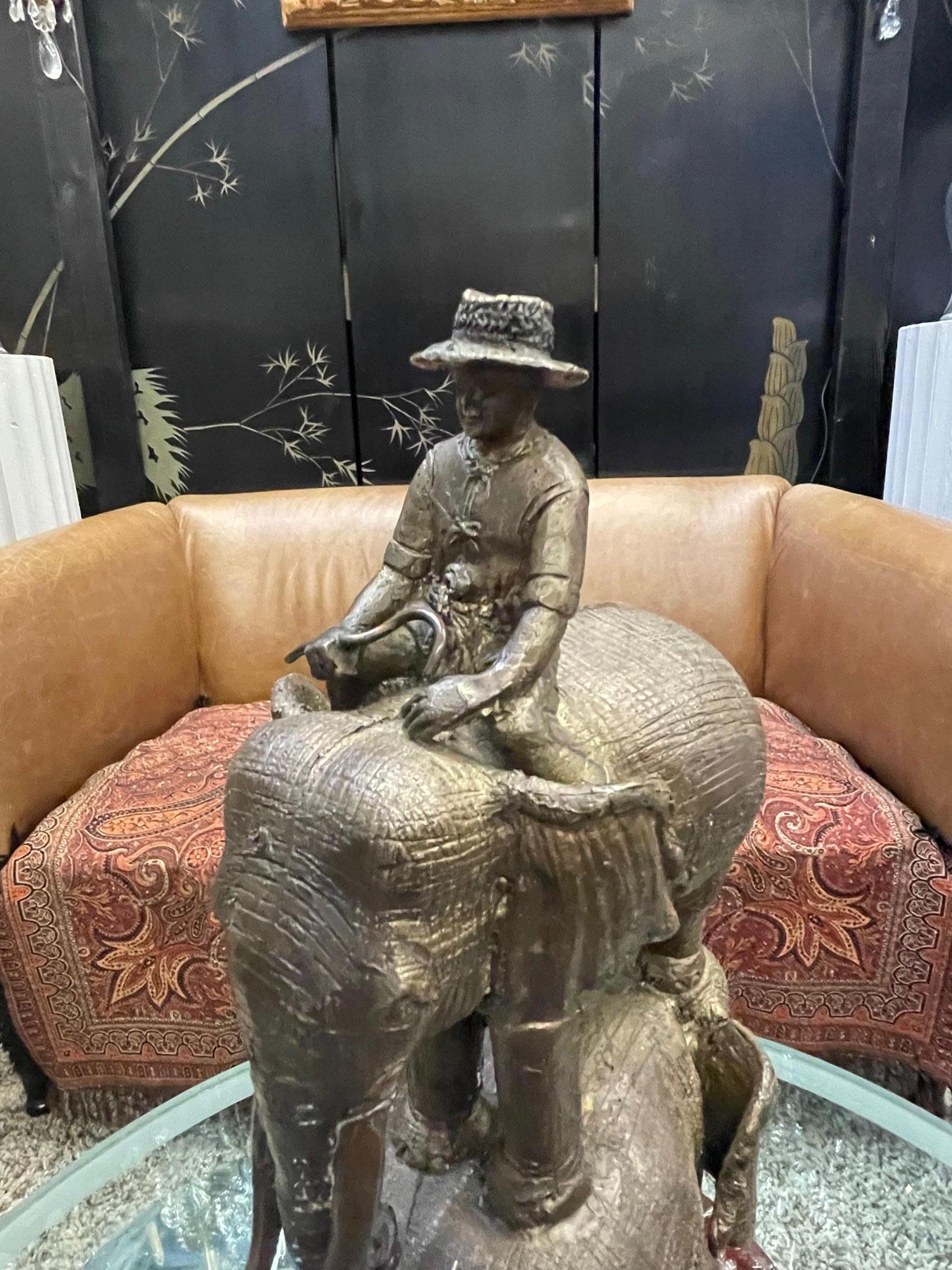 Enchanting Bronze Sculpture of a Man Riding Three Elephants For Sale 1