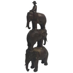 Vintage Enchanting Bronze Sculpture of a Man Riding Three Elephants