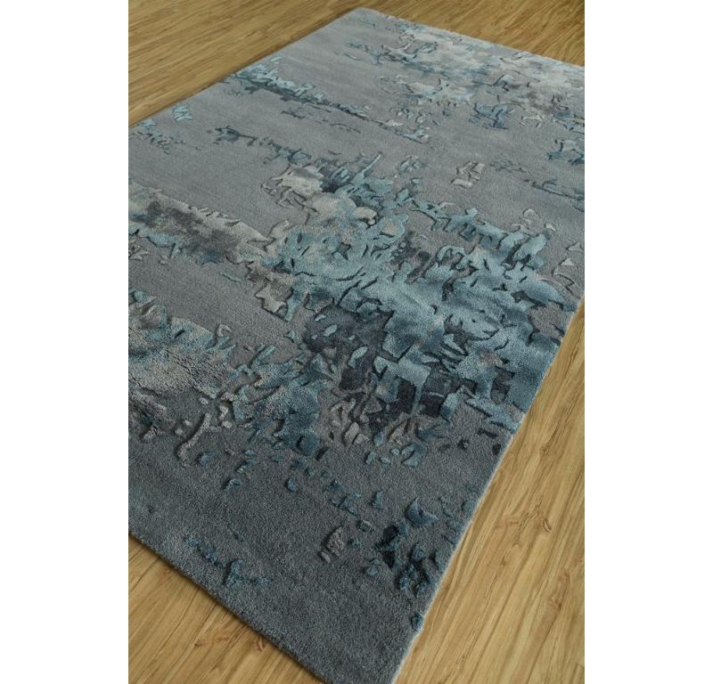 Like a cosmic masterpiece painted by the universe, our Modern Hand-Tufted Rug transports you to a realm where worlds unfold in ethereal beauty. Evoking the mystique of celestial bodies, its pastel palette harmoniously blends with vague shapes,