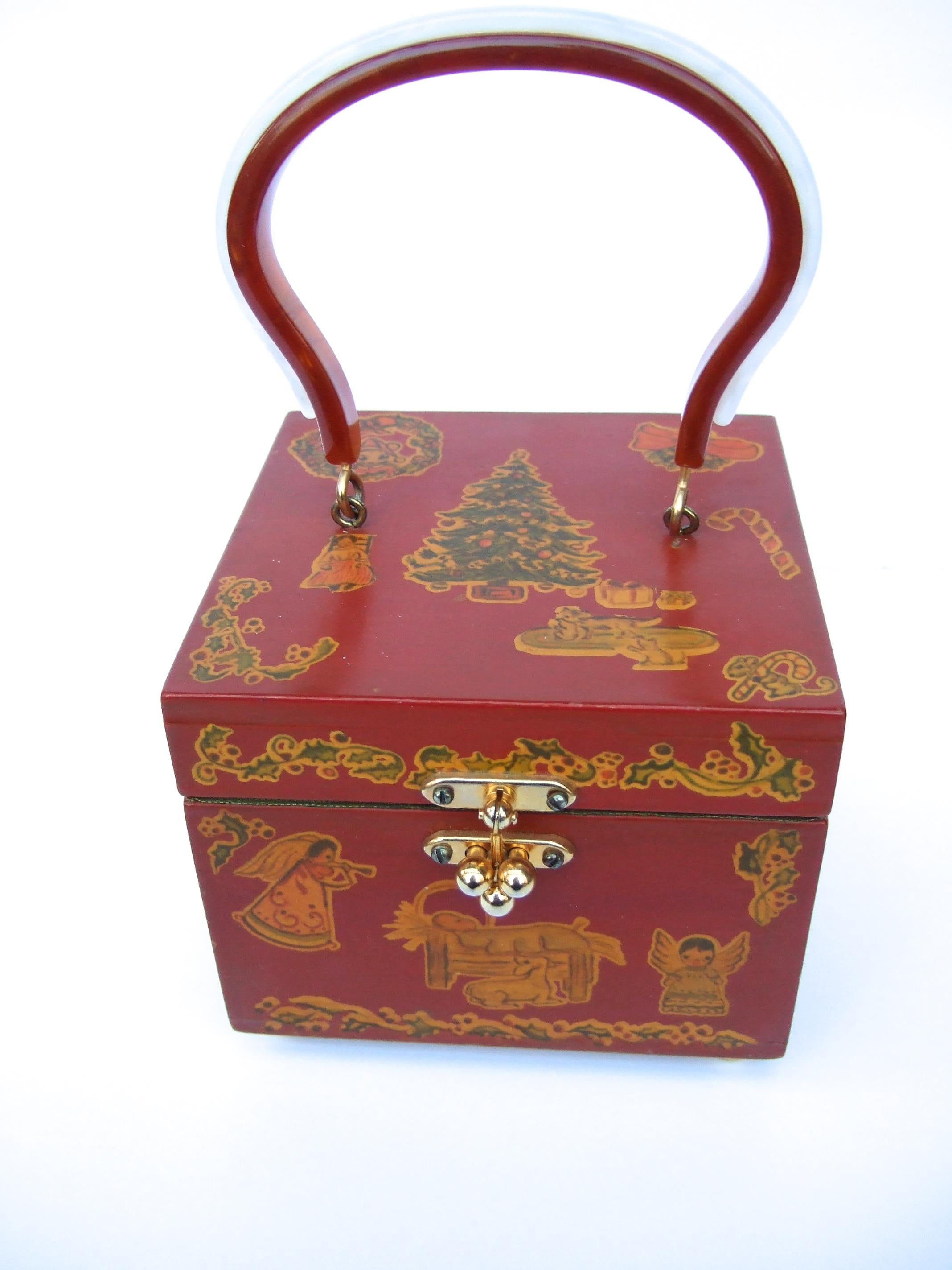 Enchanting Christmas themed handmade wood artisan decoupage box purse c 1960

The charming vintage handmade wood enamel artisan box purse is decorated with a collection of Christmas themed decoupage stencils. A Christmas tree, toys & presents, the