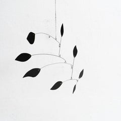 Enchanting Dynamics: Iron and Foam Kinetic Sculpture - Elegant Black in Play