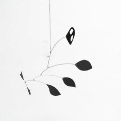 Enchanting Dynamics: Iron and Foam Kinetic Sculpture - Elegant Black in Play