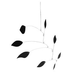 Enchanting Dynamics: Iron and Foam Kinetic Sculpture - Elegant Black in Play