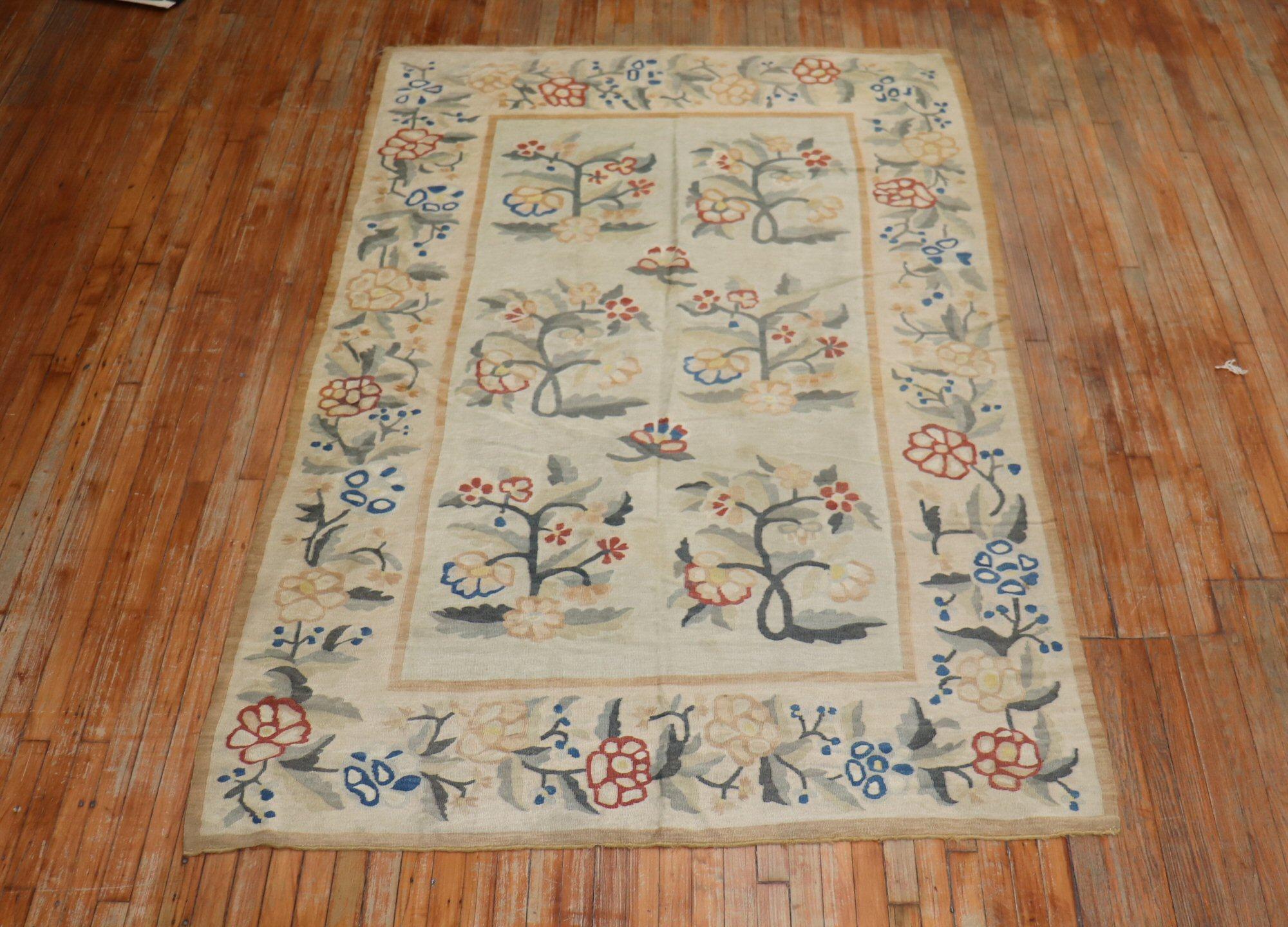 An early 20th century enchanting Bessarabian Kilim with a large scale floral design on an ivory field. The border and the field have the same motif.

Measures: 5'7” x 8'9”

Bessarabian Kilims in both pile and tapestry weaving technique are some