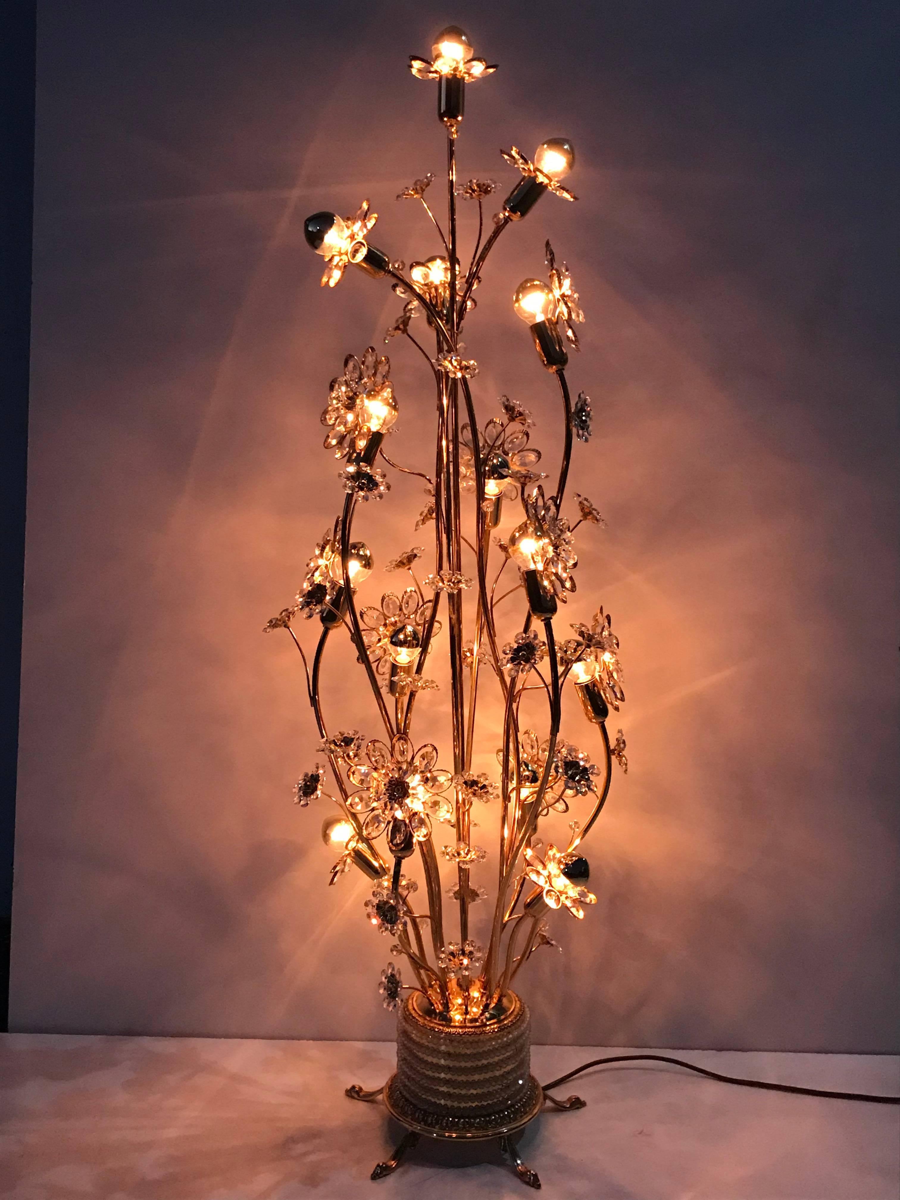 Enchanting illuminated crystal flower and brass floor lamp by Palwa
Uses up to 40watt E14 base bulbs. Photographed with 25watt bulbs (bulbs not included )
Has an on/off foot switch.