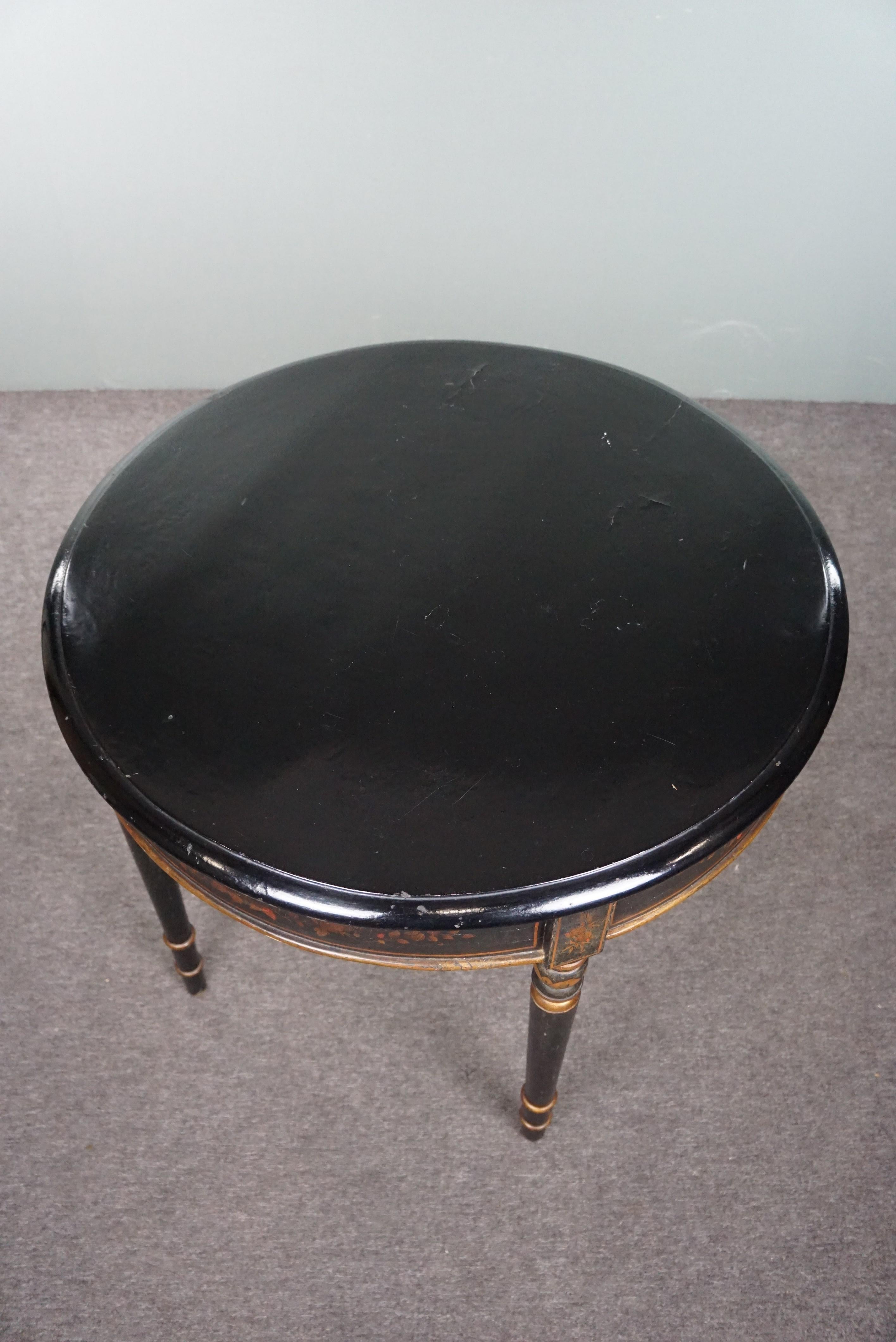 Offered is this exquisite antique center table with hand-painted Japanese/Eastern influences and motifs. Every now and then, an item comes along that touches you just a bit more than others. That's the feeling we have with this side table. With its