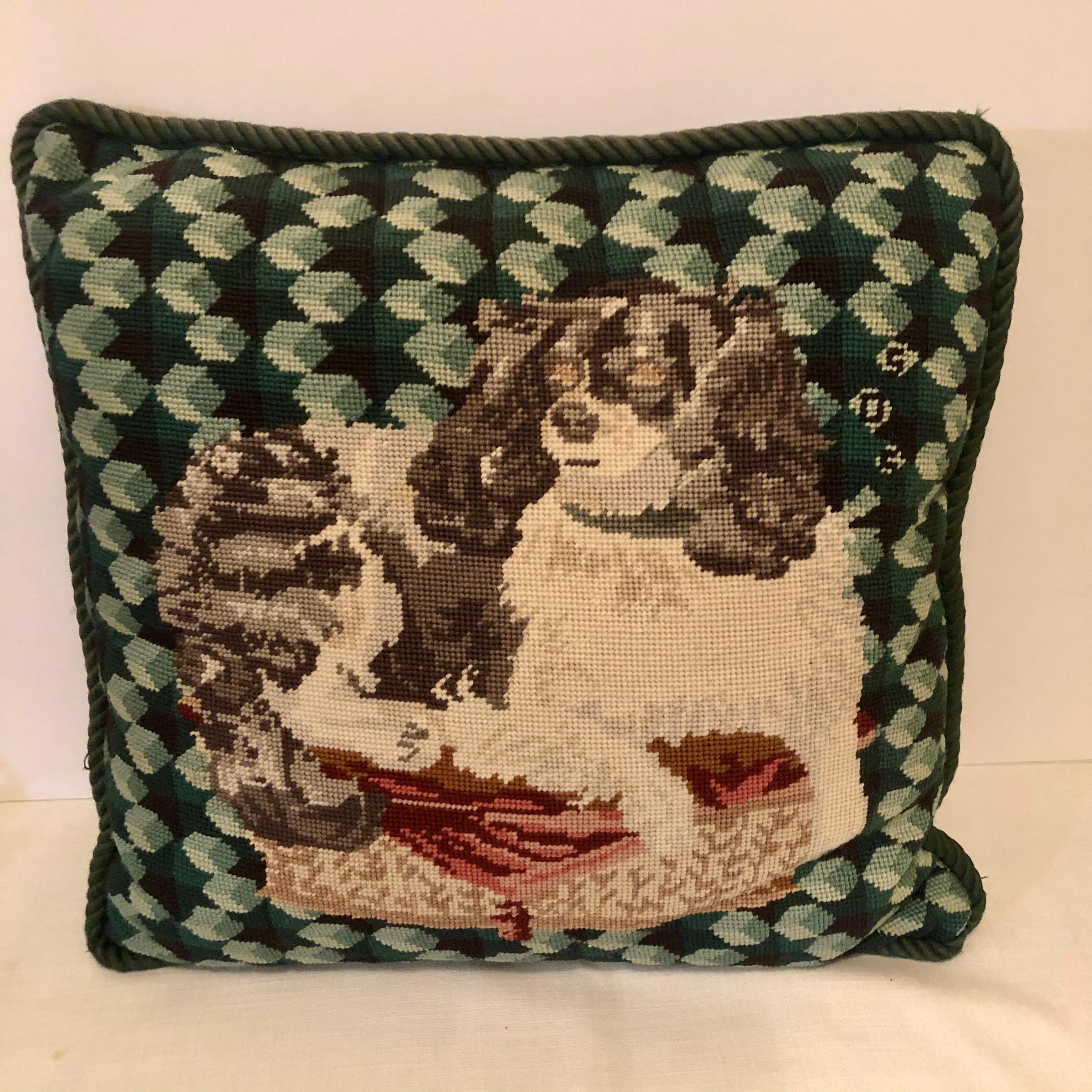This is a charming pillow with a needlepoint of a black and white cavalier King Charles spaniel. This would be a wonderful decoration for any dog lover. The back of this pillow has green velvet fabric. It is 20 inches wide and 19 inches deep. Price
