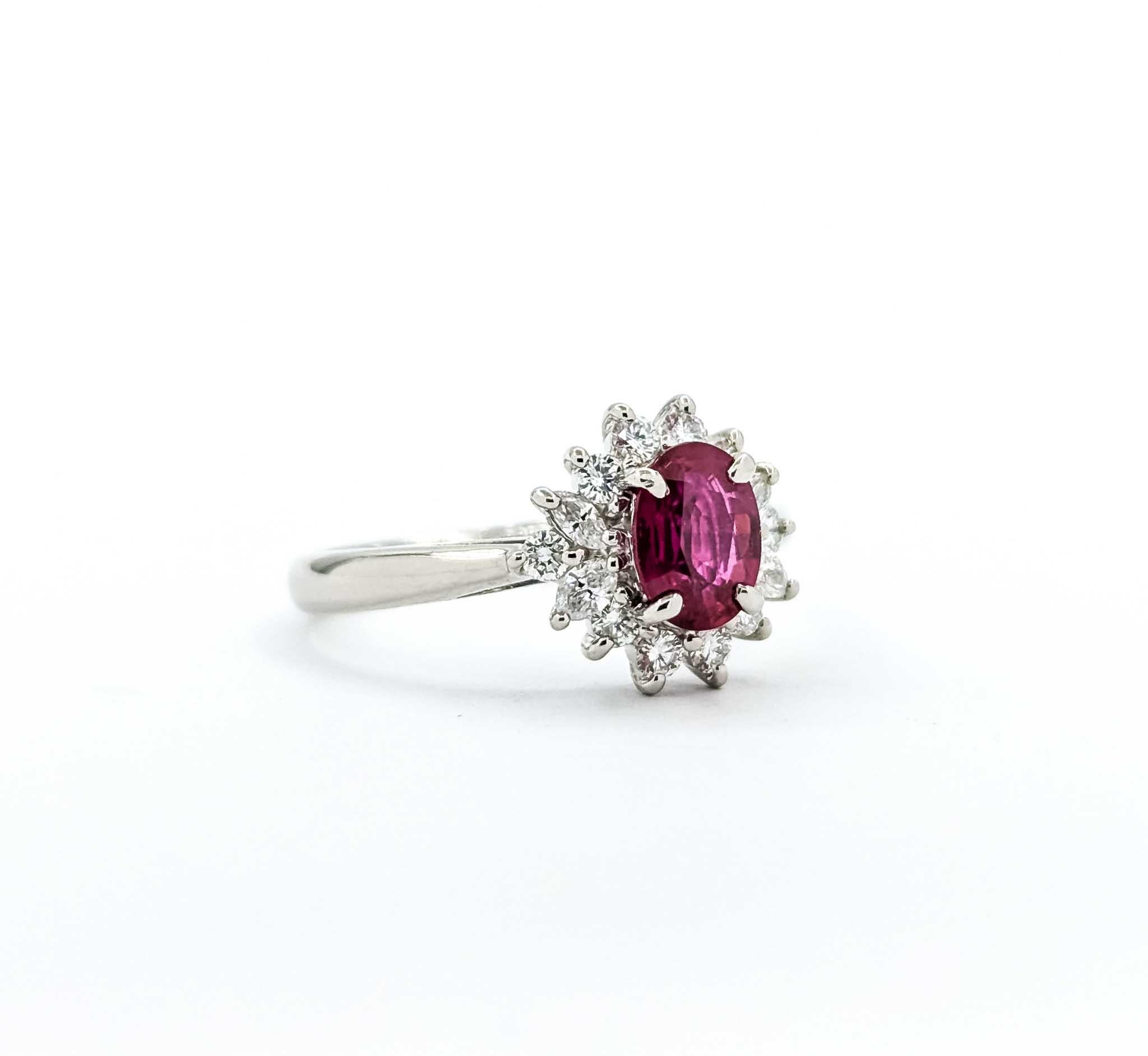 Enchanting Ruby and Diamond Ring in 900pt Halo Setting

Introducing our enchanting ring, a true masterpiece of jewelry craftsmanship, featuring a stunning 0.72ct Ruby, ensconced in a halo of 0.31ctw diamonds, all set in a 900pt setting. This ring is