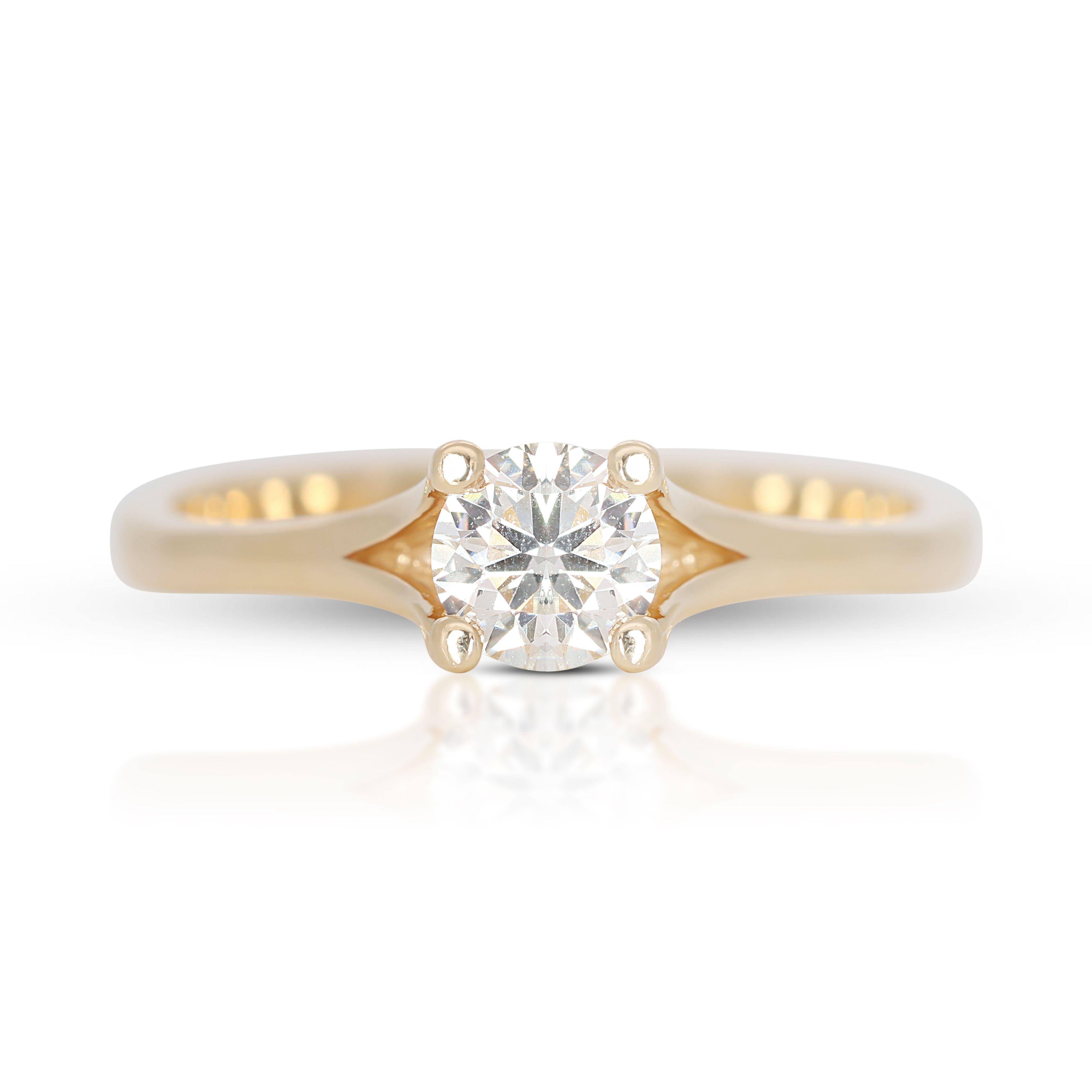 Round Cut Enchanting Solitaire: 0.38 ct Diamond Shimmers in Warm 14K Gold For Sale