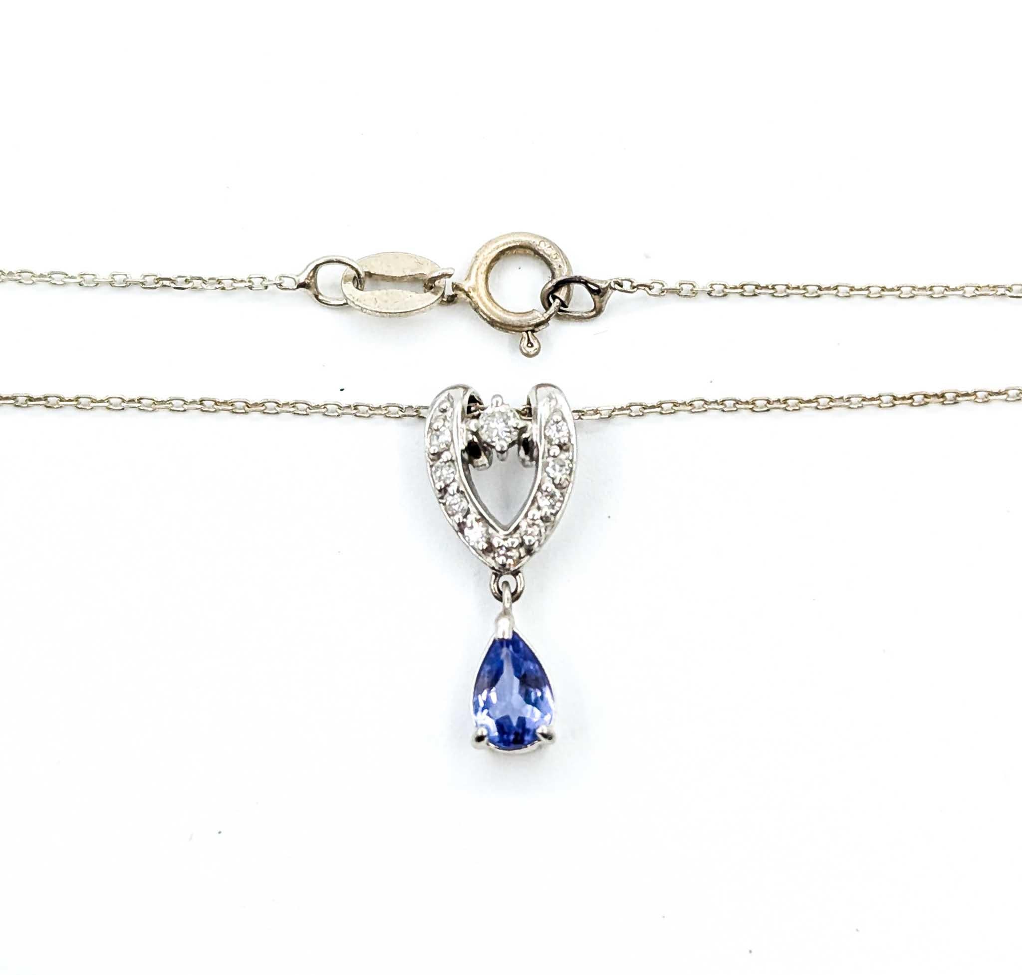 Enchanting Tanzanite and Diamond Pendant in Platinum

Introducing this beautiful Tanzanite pendant crafted in platinum with a stunning sterling silver chain dangle. The pendant showcases a magnificent 0.40-carat tanzanite, harmoniously complemented