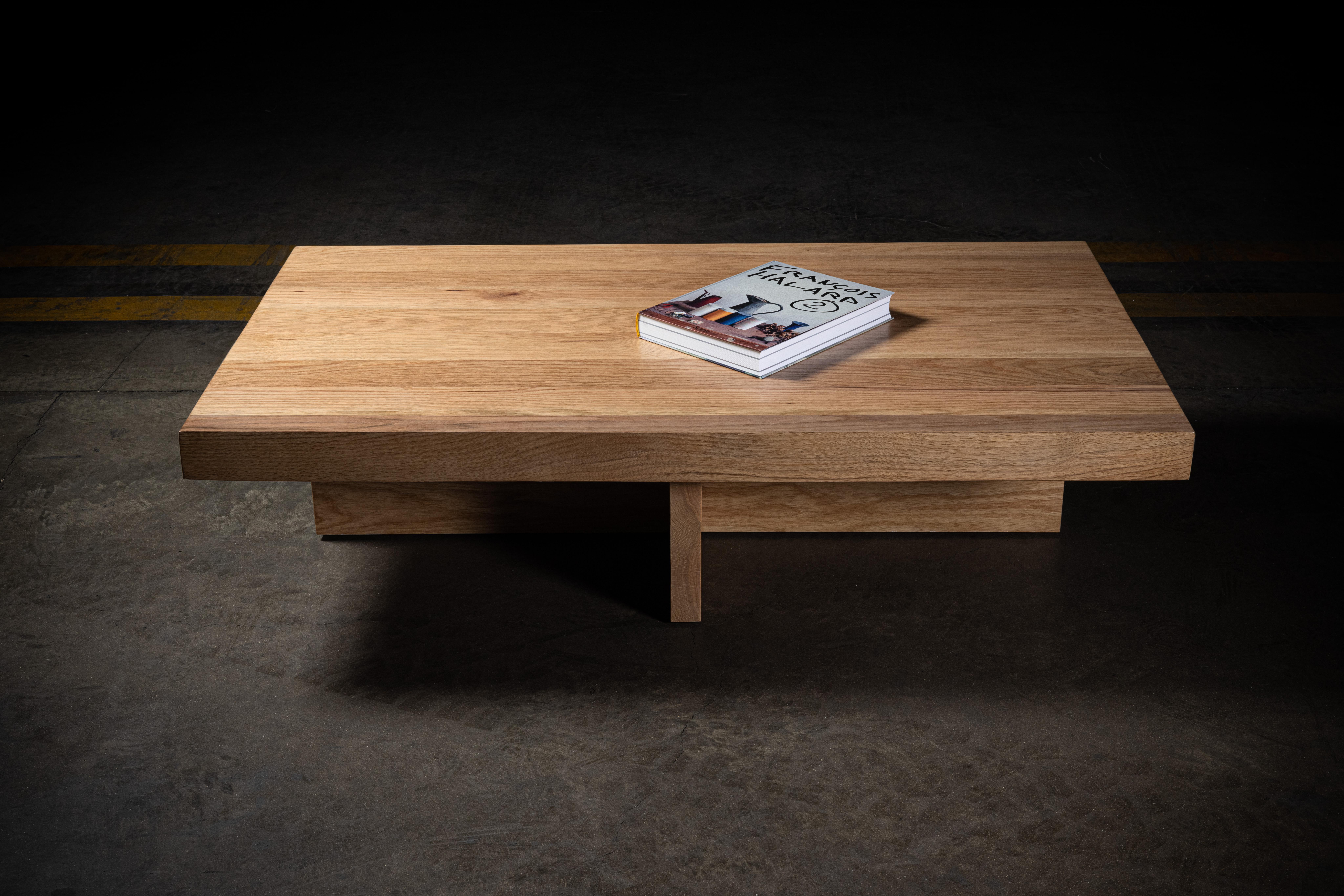 Solid oak rectangular coffee table with cross base

Measures: 3