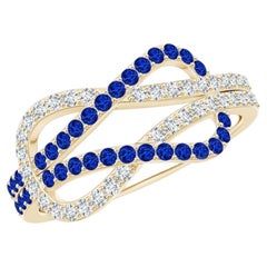 Anillo con nudo infinito de zafiro azul y diamantes engastados, en oro macizo de 14K
