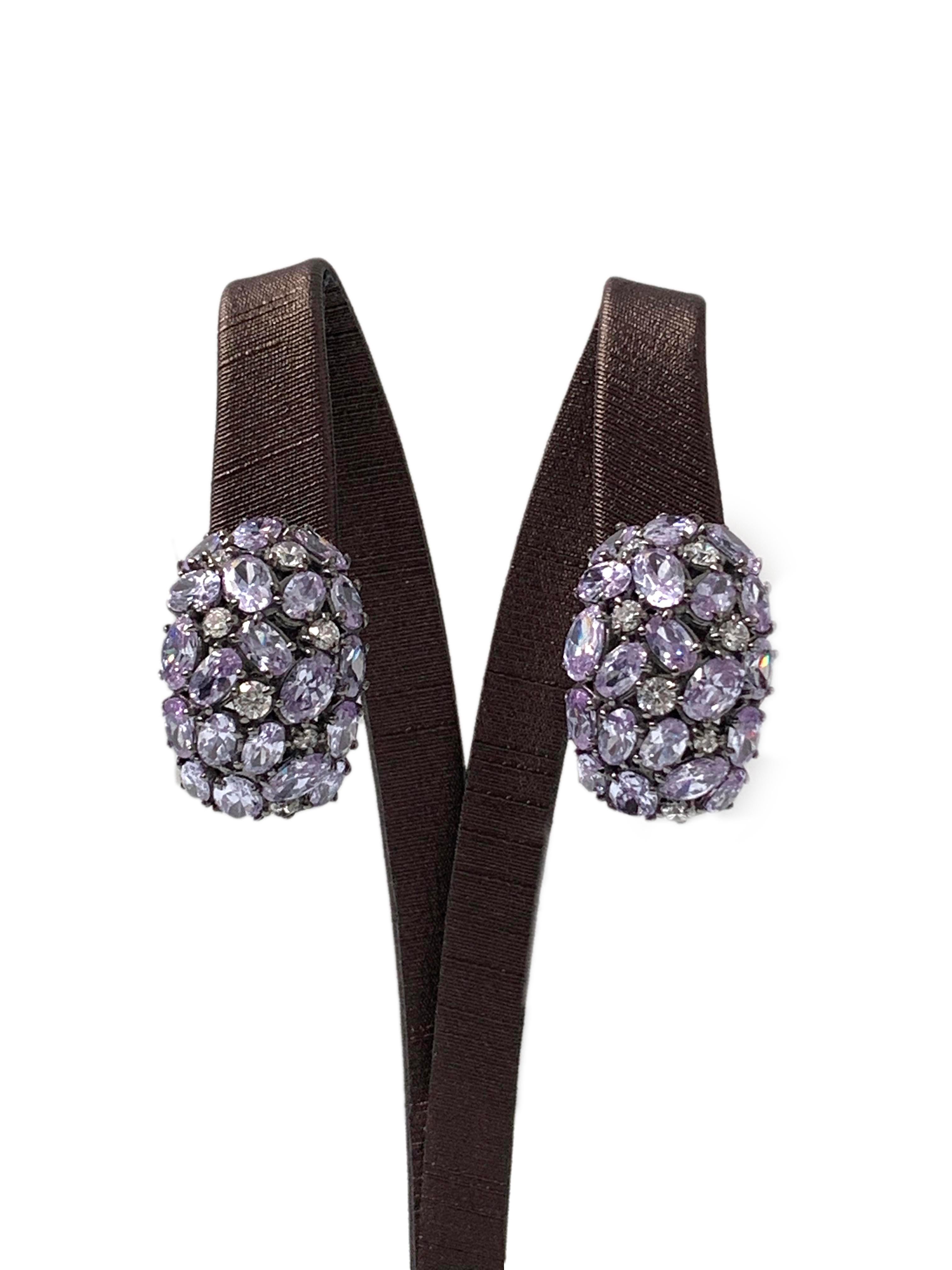 Fabulous encrusted Lavender CZ and Simulated Diamond Clip-on Earrings

These earrings feature 94 pcs of oval lavender cz and round cubic zirconia, handset in black rhodium plated sterling silver. The earrings measure approximately 1