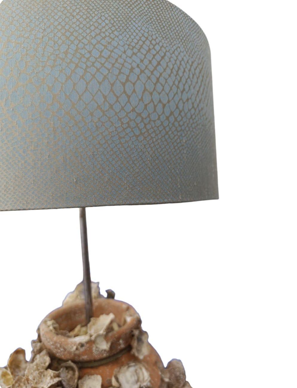 These lamps are  stunning  sculptural treasures  from the sea.

For Centuries Fishermans throught  the Mediterranena have been used  terracota pots
Each pot we have for sale  will have been used for decades or more , meaning that they  are encrusted