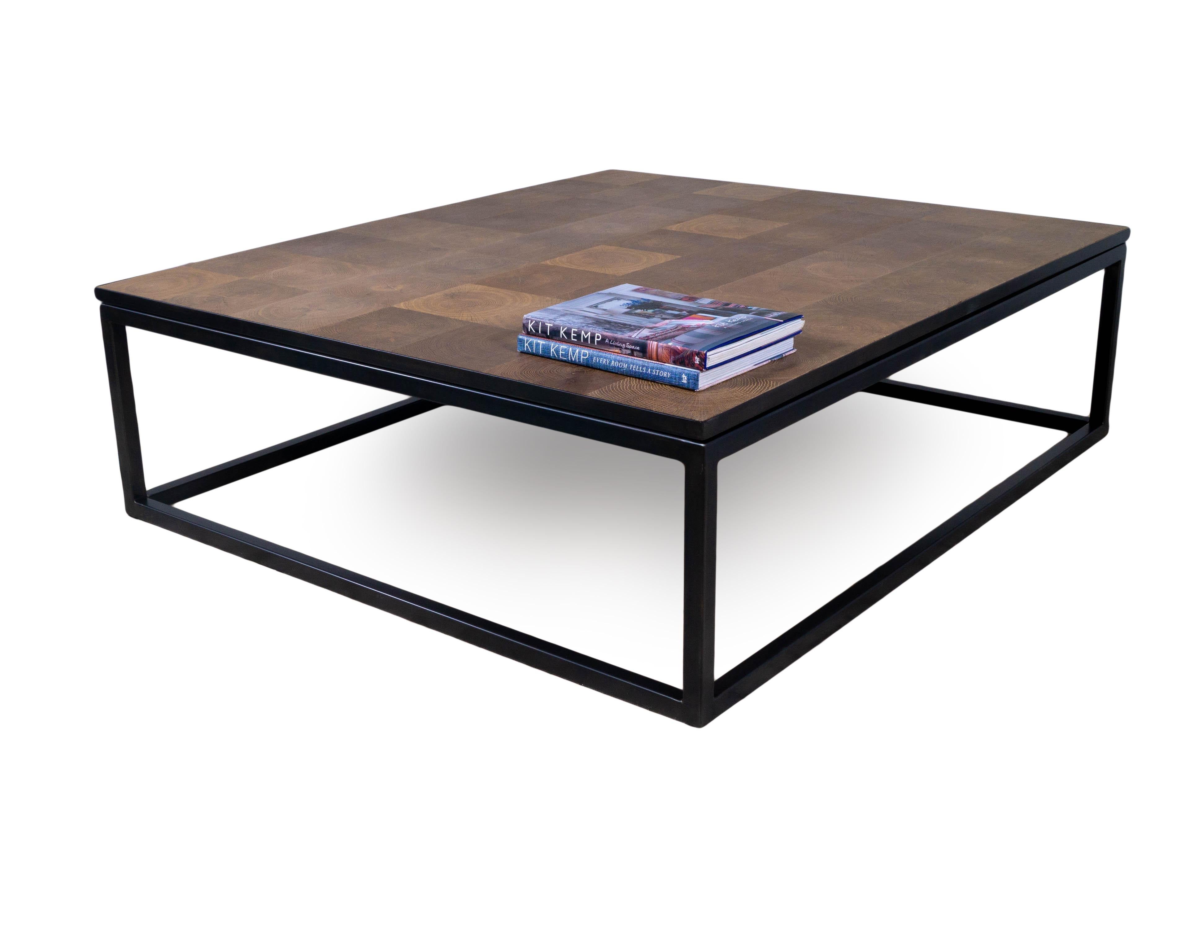 This end cut oak with plank top and metal base coffee table is a part of our Vision & Design collection which is designed by and exculsive to Brendan Bass. This coffee table features squares of end cut oak which celebrates the beauty and life of the
