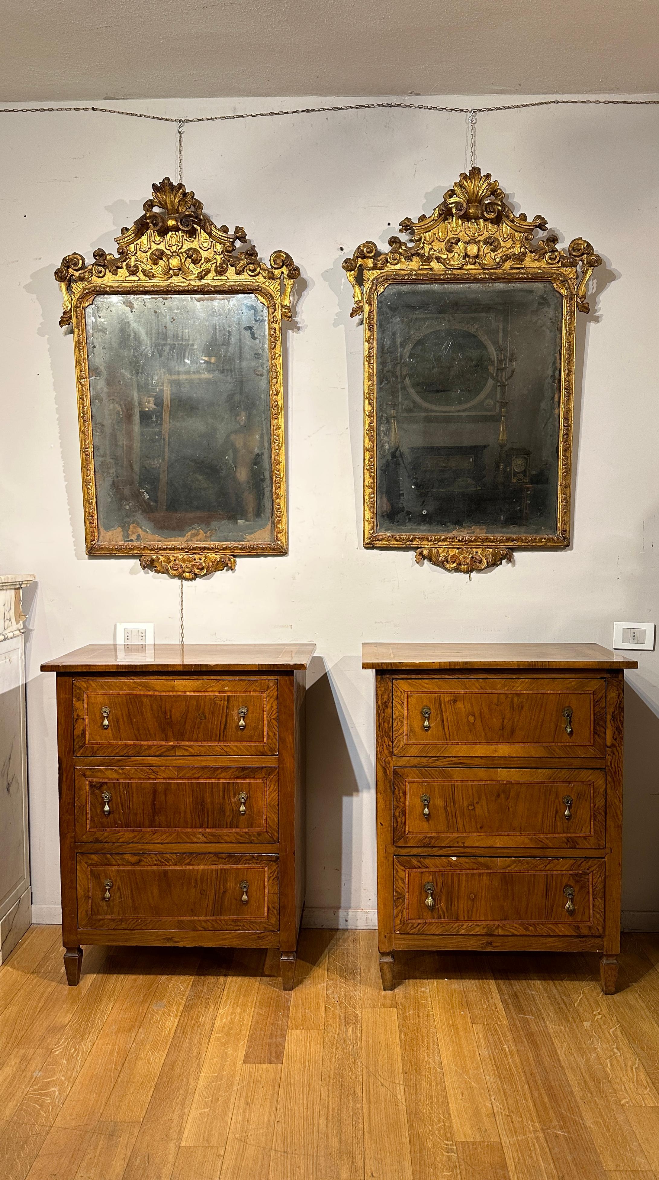 These splendid three-drawer chests of drawers are a fascinating example of late 18th century Venetian manufacturing, during the Neoclassical era. Made with fir wood entirely veneered in walnut, embellished with geometric patterned fruit wood