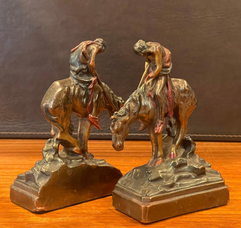 Pair of bronze patinated cast iron bookends 