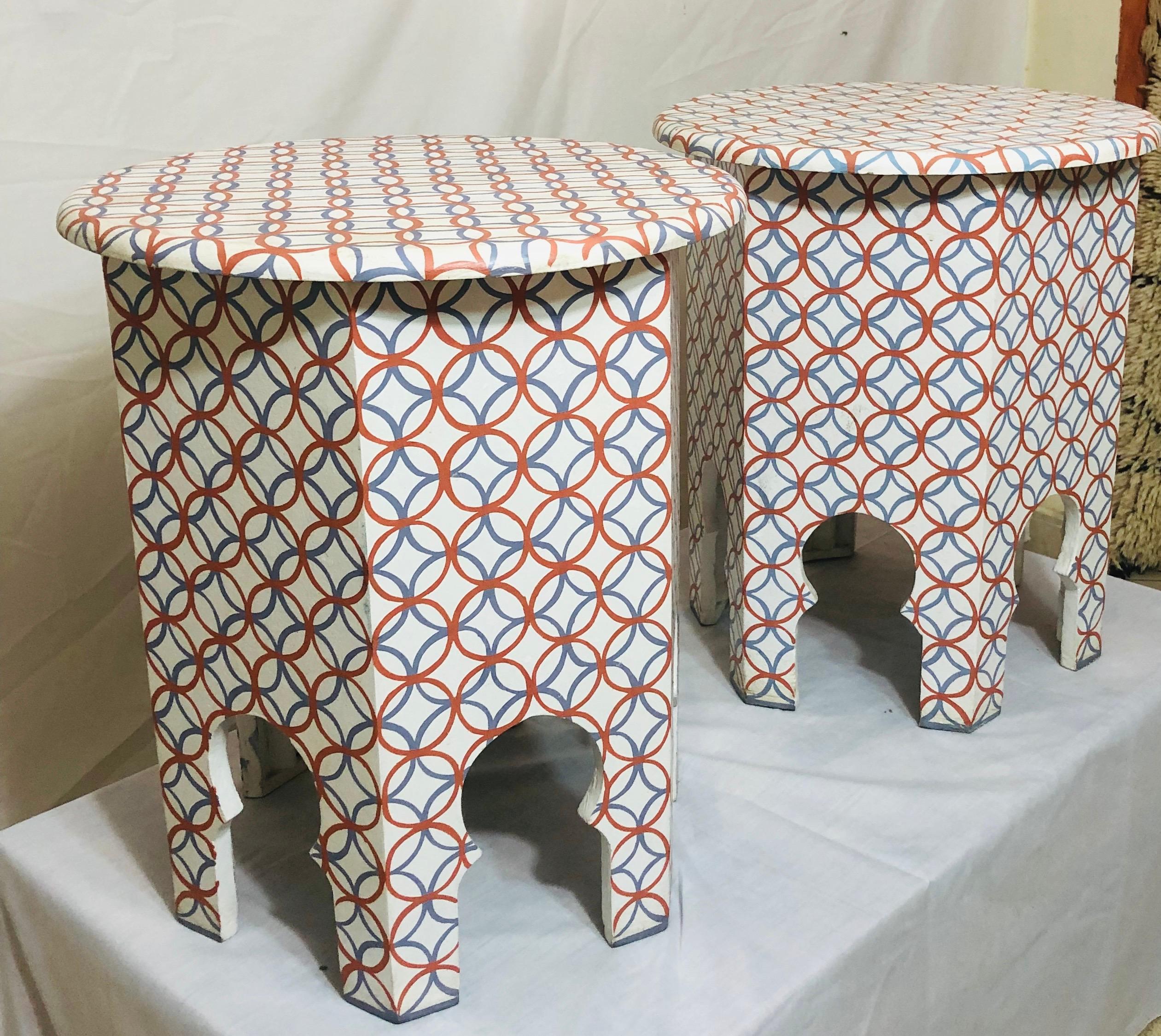 Modern Moroccan white end, side or lamp table, a pair 
This stylish pair of white, blue and orange handmade side or end tables have beautiful arched base and features a modern overall design. Finely hand-painted by master artisans, the tables