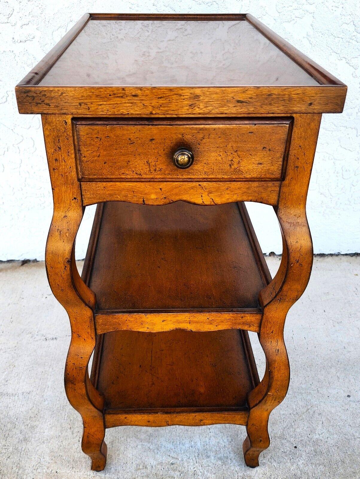 For FULL item description click on CONTINUE READING at the bottom of this page.

Offering One Of Our Recent Palm Beach Estate Fine Furniture Acquisitions Of An
Italian Style Center End Side Table 3-Tier in Solid Distressed Fruitwood with 1 Drawer by