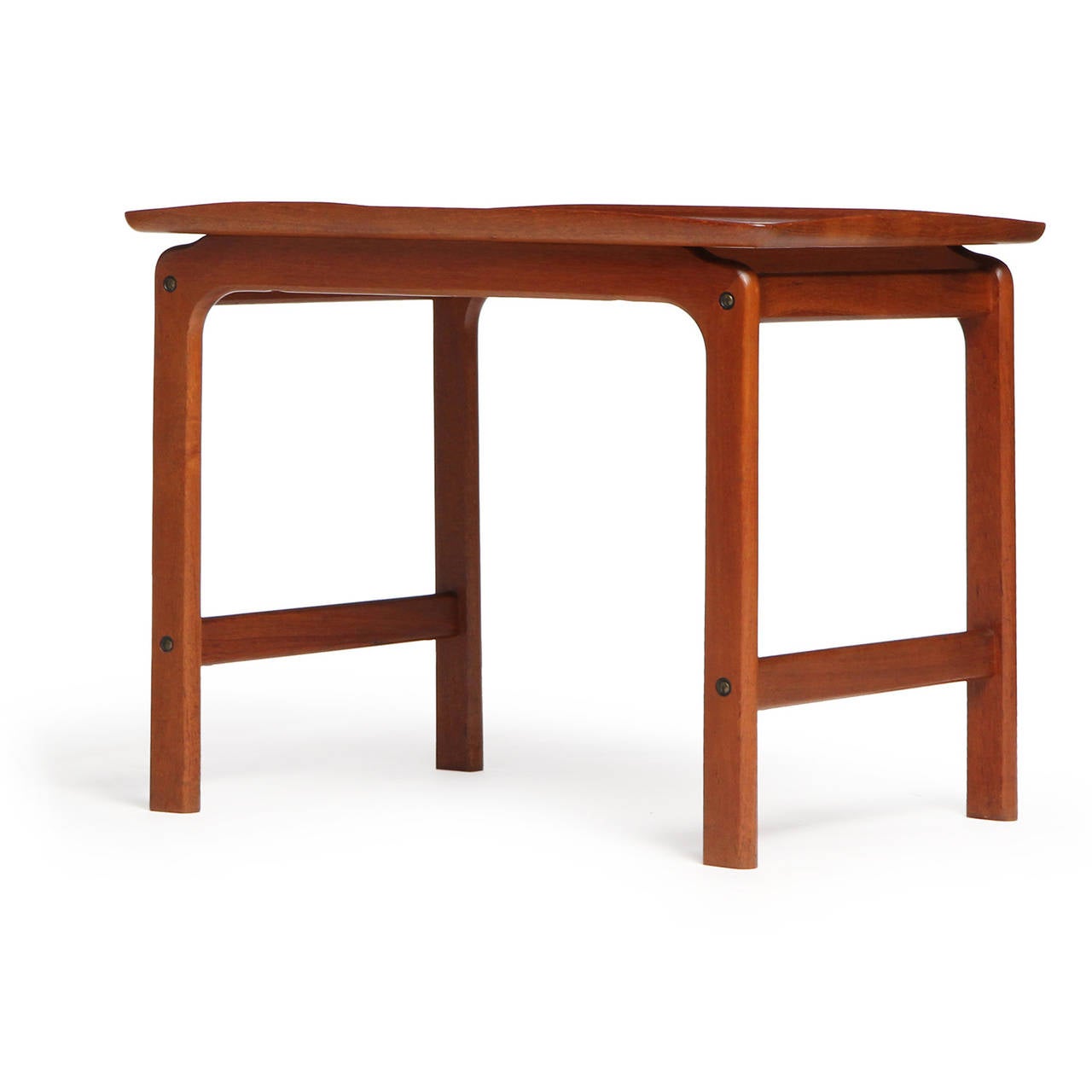 A finely crafted Scandinavian Modern occasional table or end table in highly figured warm toned teak. Finely honed curved edges. Designed by Peter Hvidt and Orla Molgaard-Nielsen, produced in Denmark, circa 1950s.