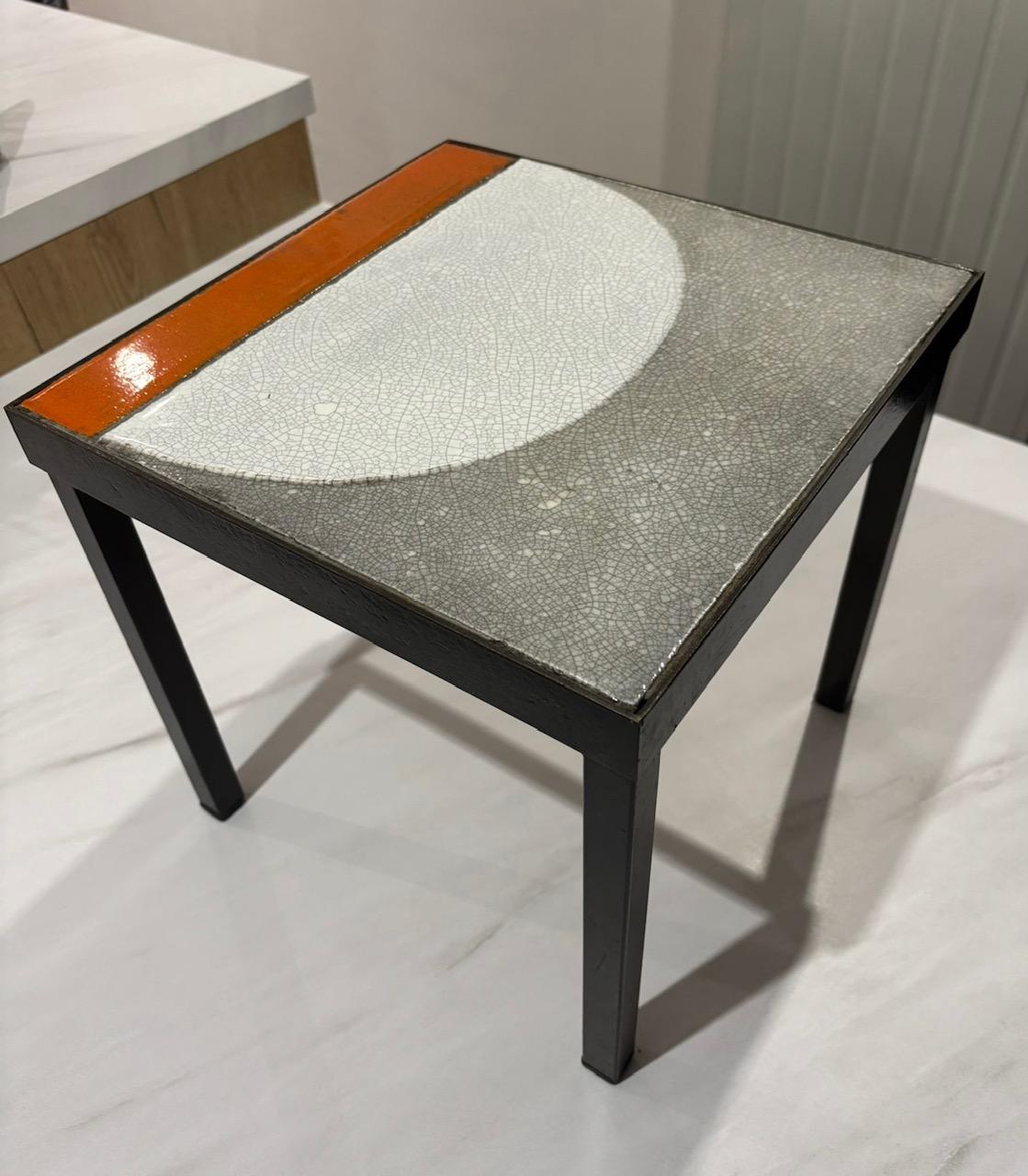 End table made up of glazed lava top realized by Roger Capron in the 1960's
Both structure and feet are in black lacquered steel
Table is in good original condition .
Structure and feet may show some light wear