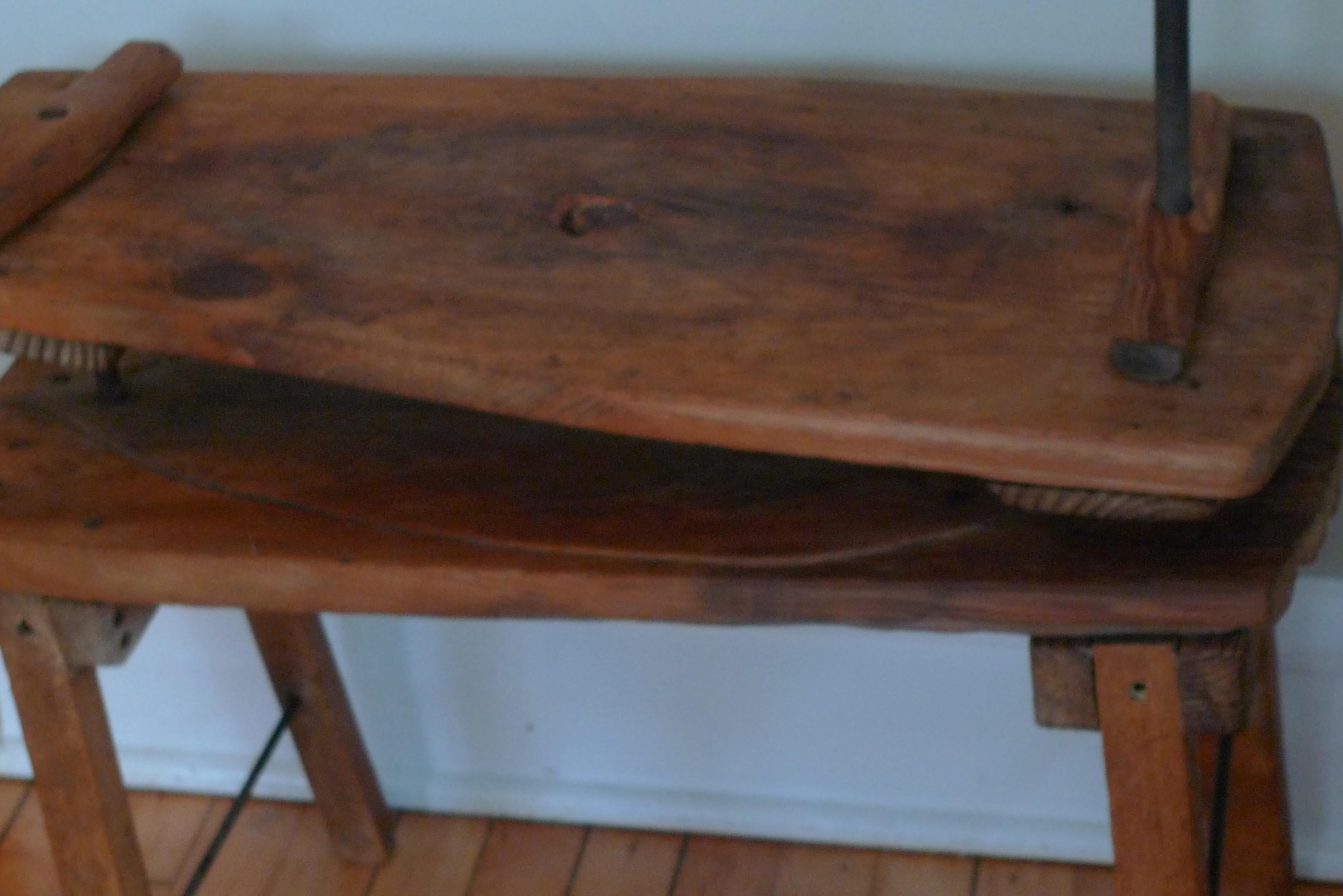 French country wooden cheese press, 19th century, as unique end table. Agrarian Classic. The wood is ancient and patinated. A level surface is attained by adjusting screwed posts to varying heights and configurations. The table that results is a