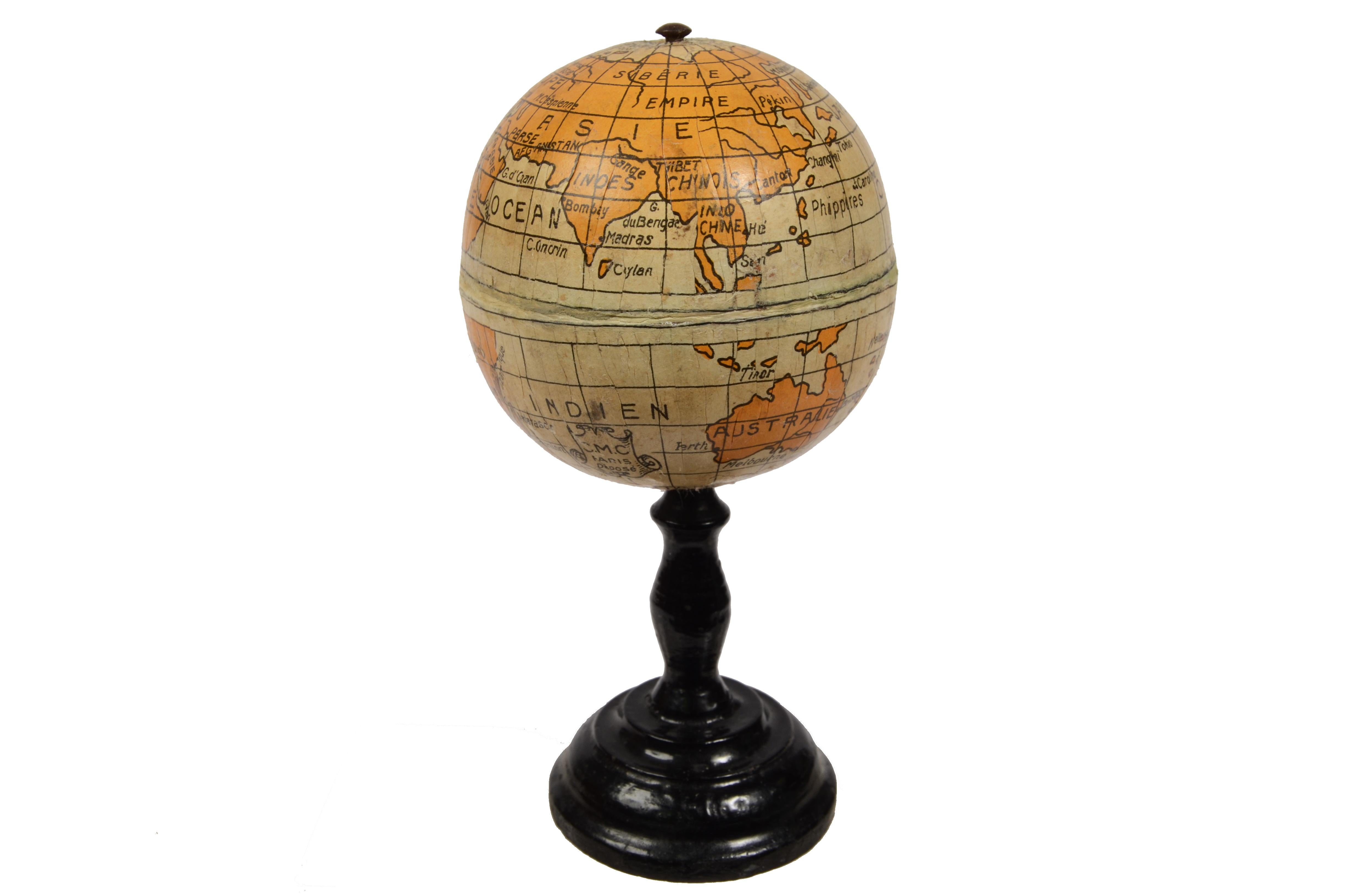 Small terrestrial globe signed C.M.C. Paris, end of XIX century. Papier maché sphere and turned and ebonized wooden base. Height cm 13 - inches 5.1, diameter of sphere cm 6,5 - inches 2.6. Very good condition.
Shipping is insured by Lloyd's London;